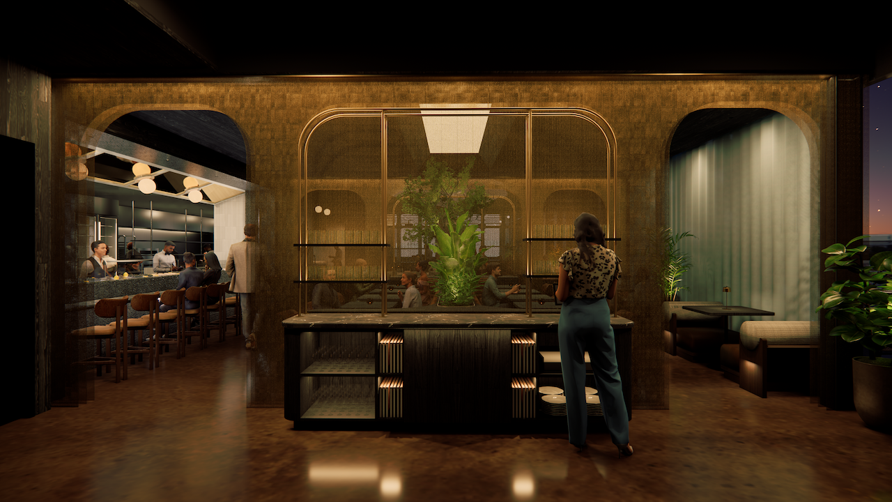 Interior of a modern restaurant with warm lighting, a woman standing by a counter adorned with plants, people sitting at a bar on the left, and booth seating on the right.