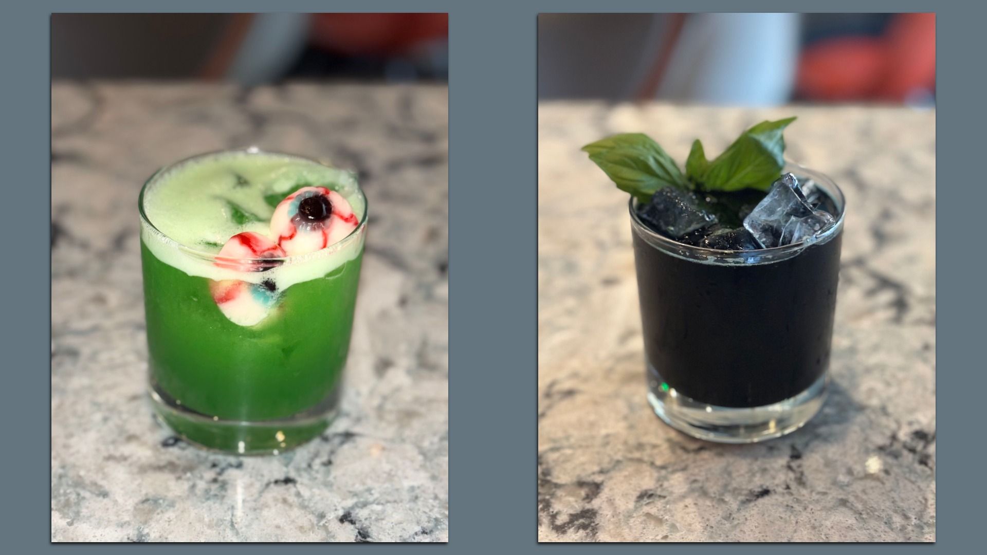 Two cocktails on a marble counter: left a bright green drink with a foamy top and a red-and-white candy garnish; right a dark, almost black cocktail with ice cubes and a fresh basil leaf.