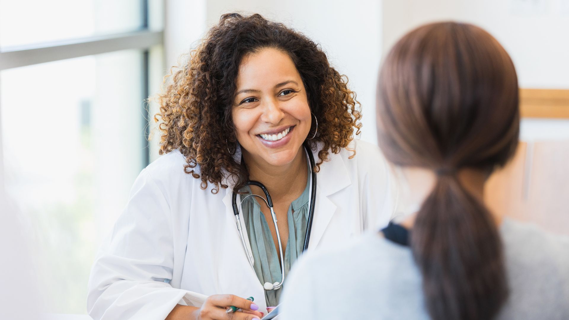 A female doctor talking to a patient. 