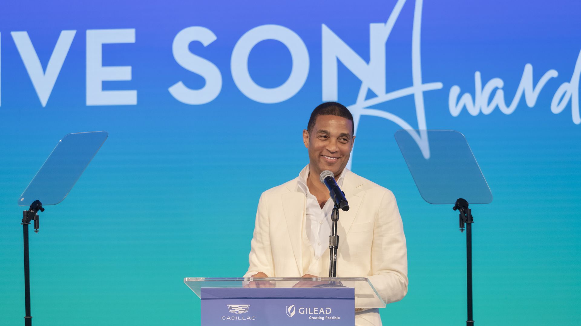 Don Lemon speaks at an award ceremony.