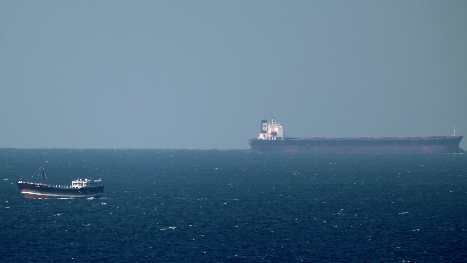 An oil tanker cruises towards the Strait of Hormuz off the shores of Khasab in Oman on January 15, 2011