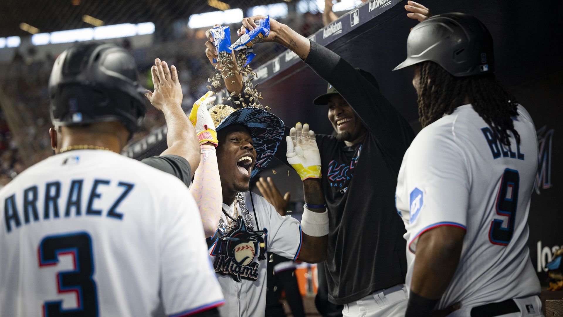 Miami Marlins center fielder Jazz Chisholm Jr. (2) is congratulated by teammates after hitting a grand slam during the third inning against the Atlanta Braves on Sunday, Sept. 17, 2023, at loanDepot Park in Miami.