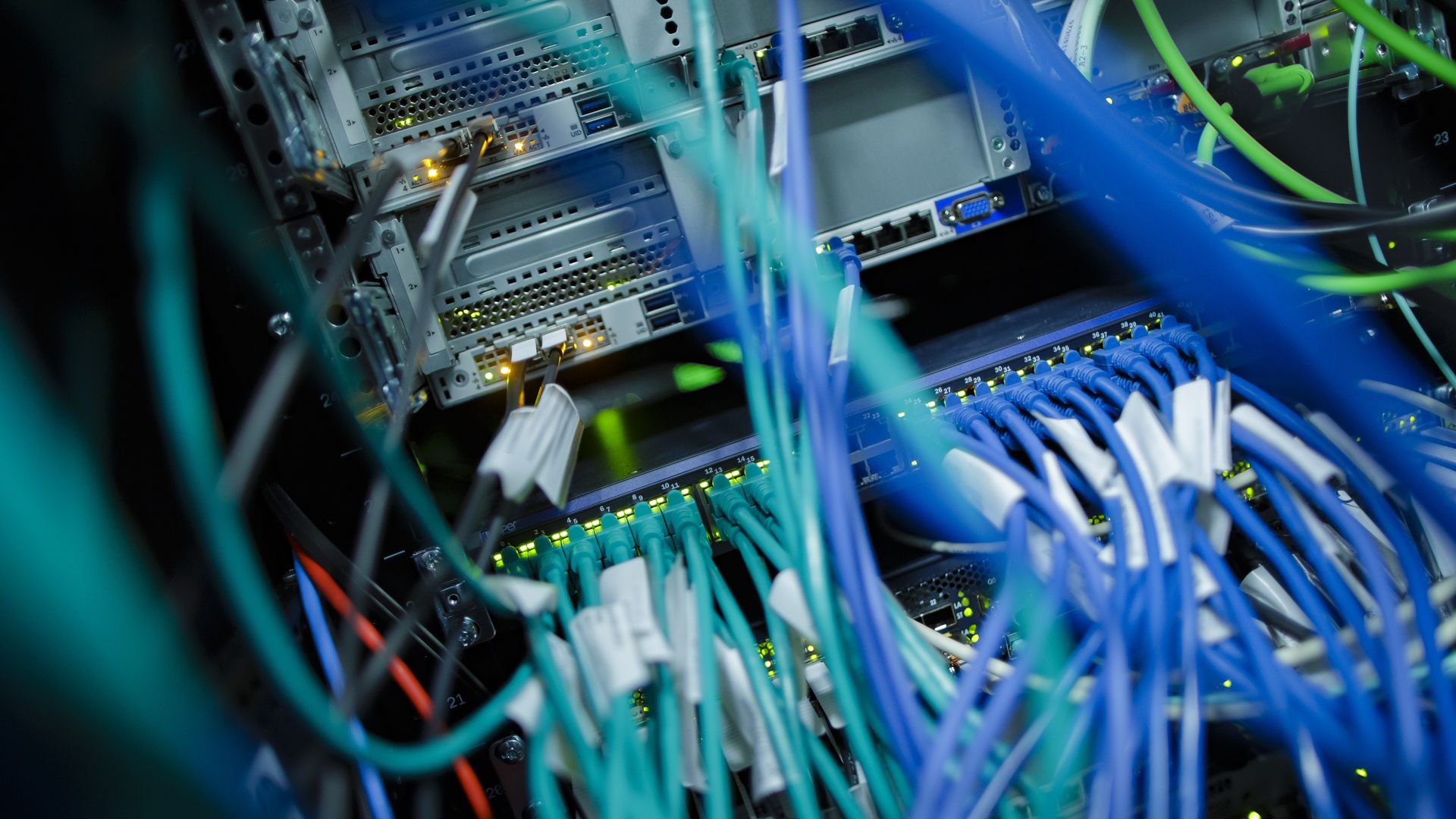 Close-up photo of cables and LED lights in a computer server