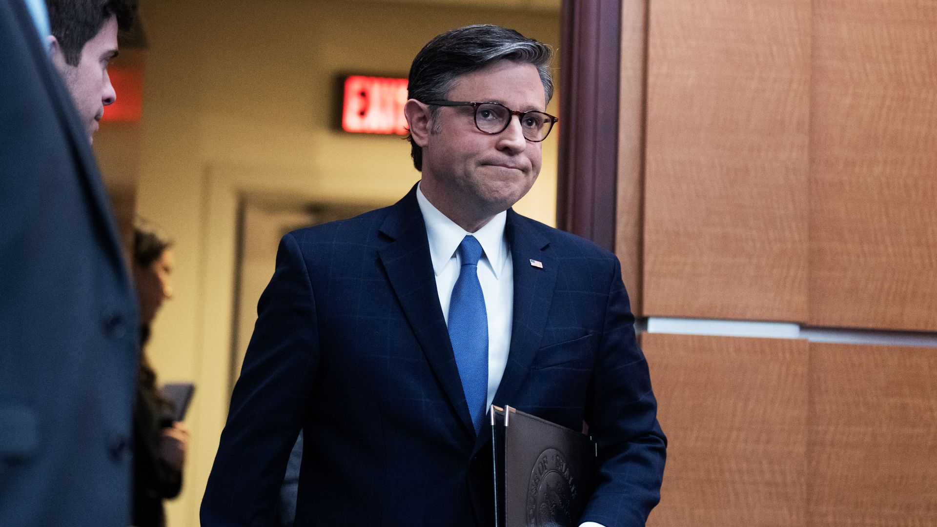 Speaker Johnson arrives for a news conference in the Capitol