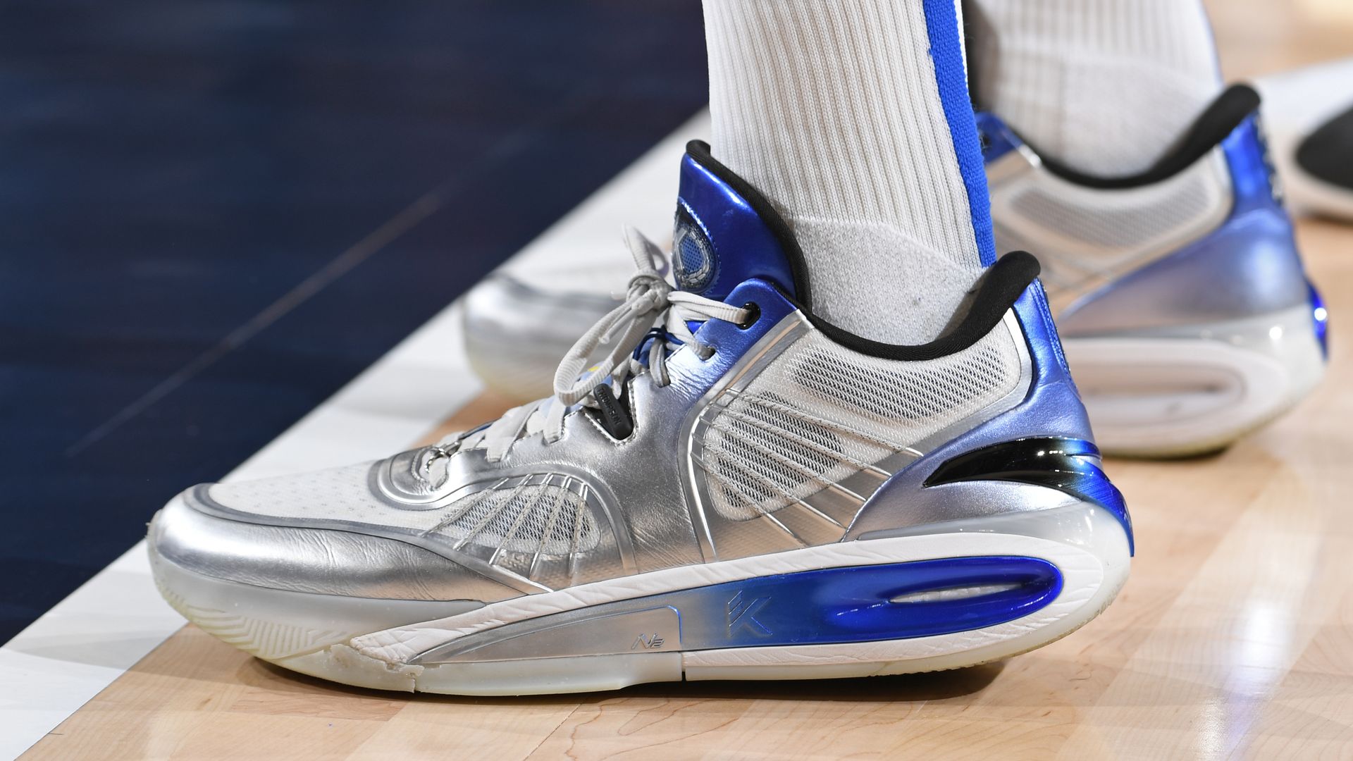 A pair of silver and blue shoes