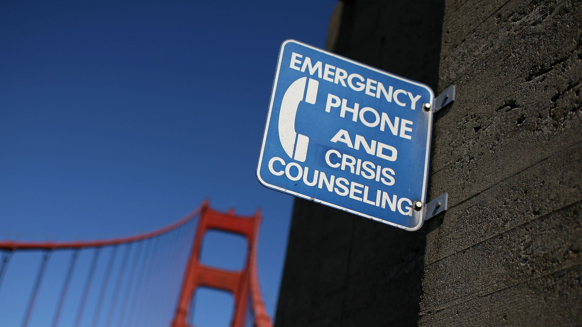 A sign for an emergency phone is seen on a span of the Golden Gate Bridge.