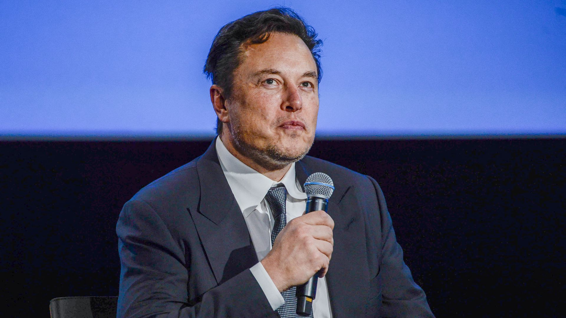 Tesla CEO Elon Musk looks up as he addresses guests in Norway.