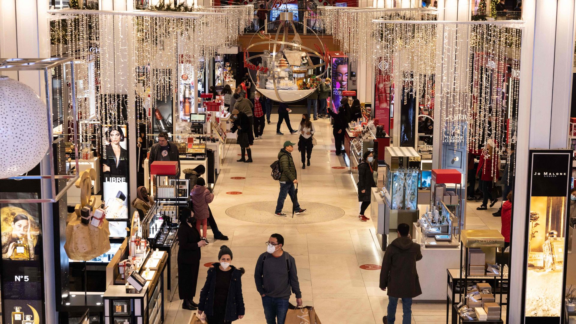 Shoppers browse Coach handbags in the Macy's Herald Square
