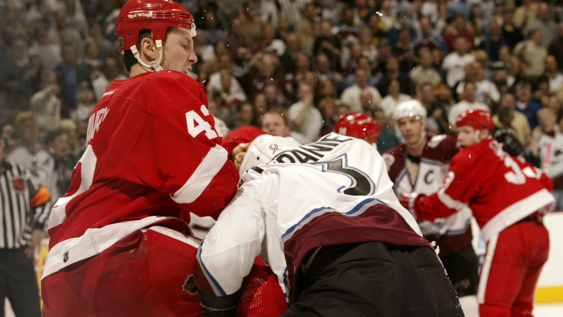 Sean Avery #42 of the Detroit Red Wings fights Pascal Trepanier #3 of the Colorado Avalanche in 2002