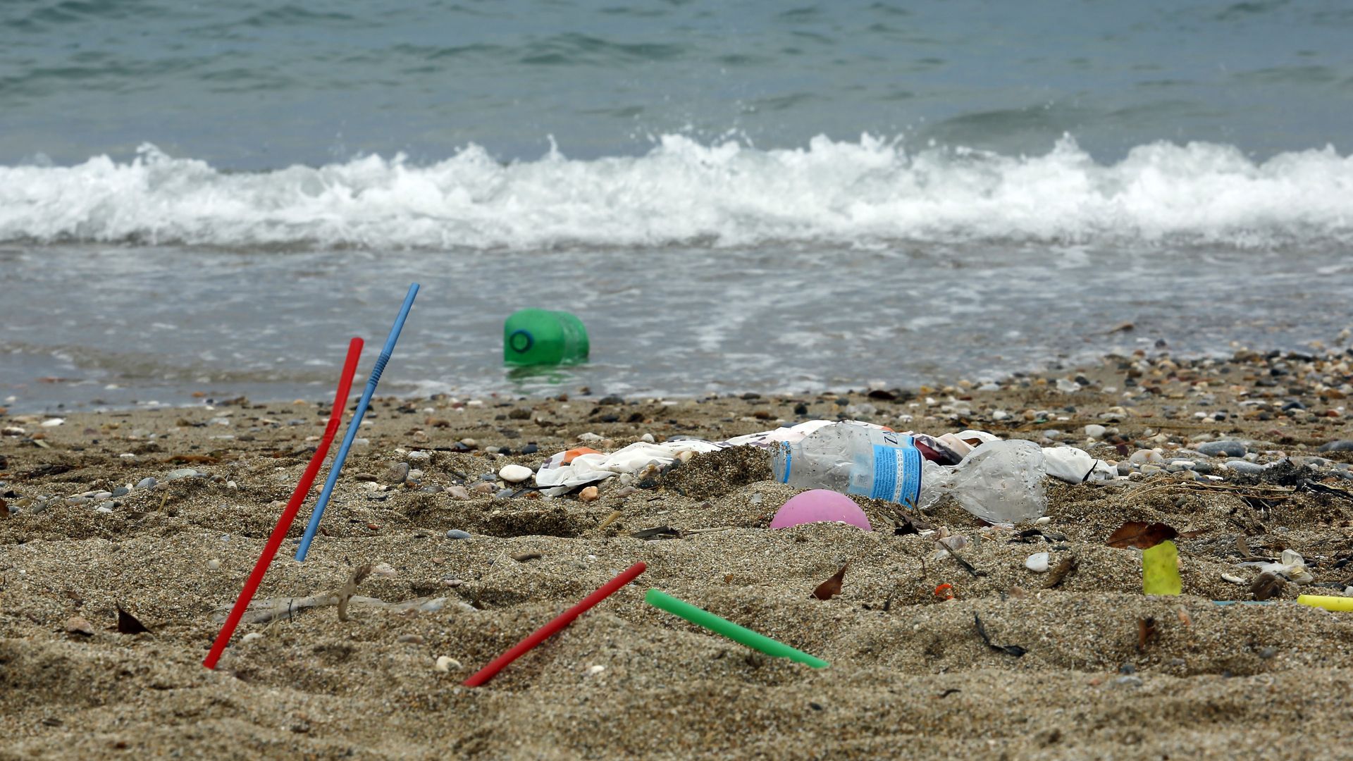 Plastic garbage lying on the Aegean sea beach near Athens on June 26, 2018 , Greece 
