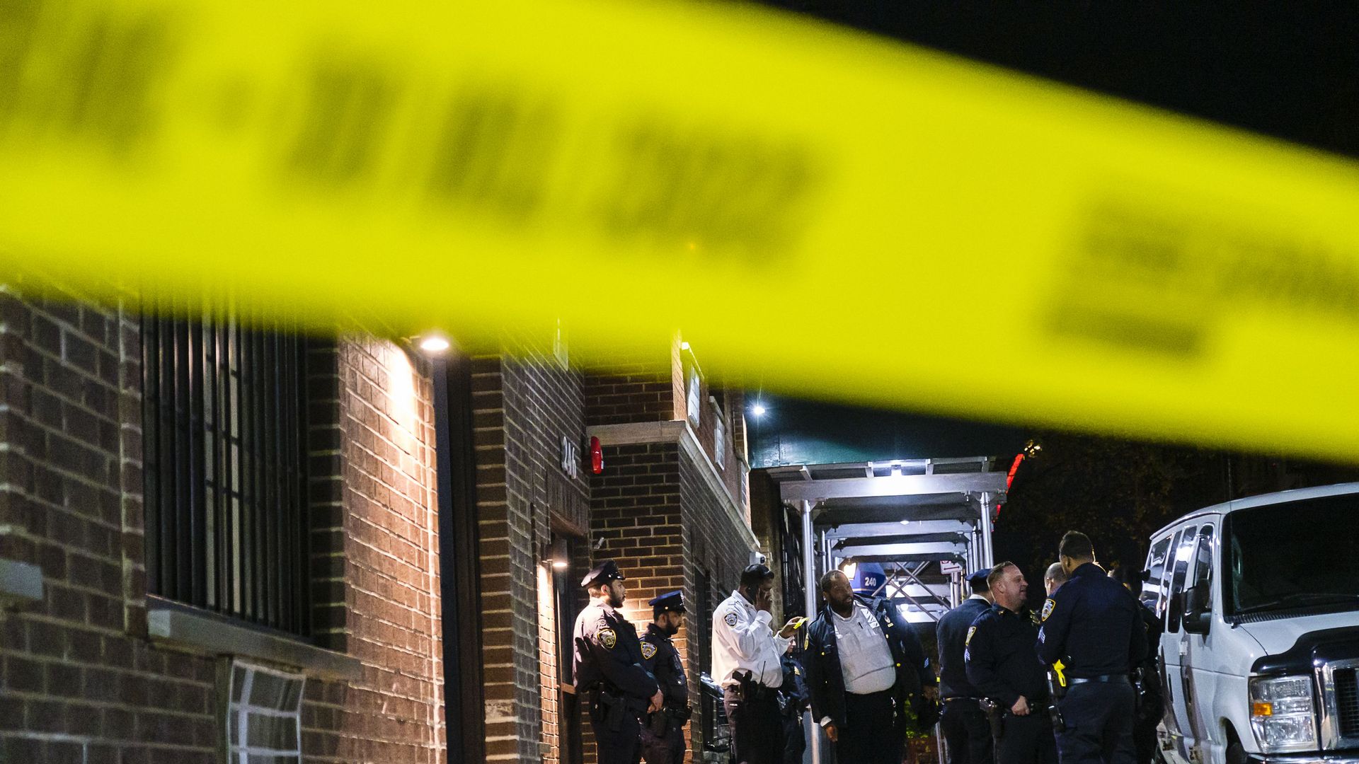 New York Police Department officers and detectives investigate the fatal stabbing of two young children at an apartment building on Echo Place in Mount Hope, Saturday, Nov. 26, 2022. 