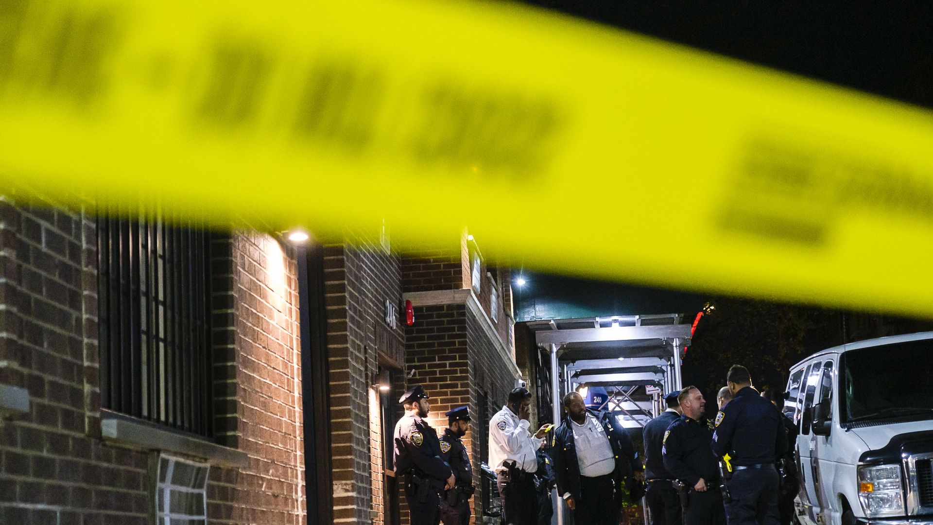 New York Police Department officers and detectives investigate the fatal stabbing of two young children at an apartment building on Echo Place in Mount Hope, Saturday, Nov. 26, 2022.