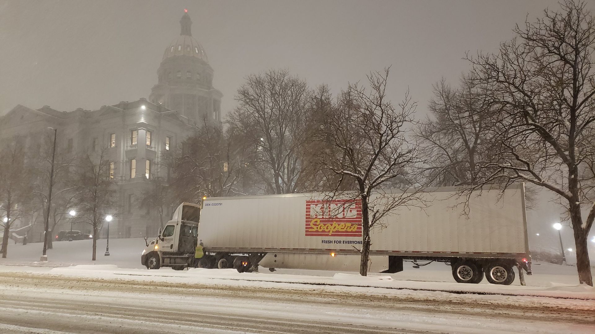 A King Soopers truck stuck in the snowstorm by the Colorado State Capitol on Feb. 24 in Denver. 