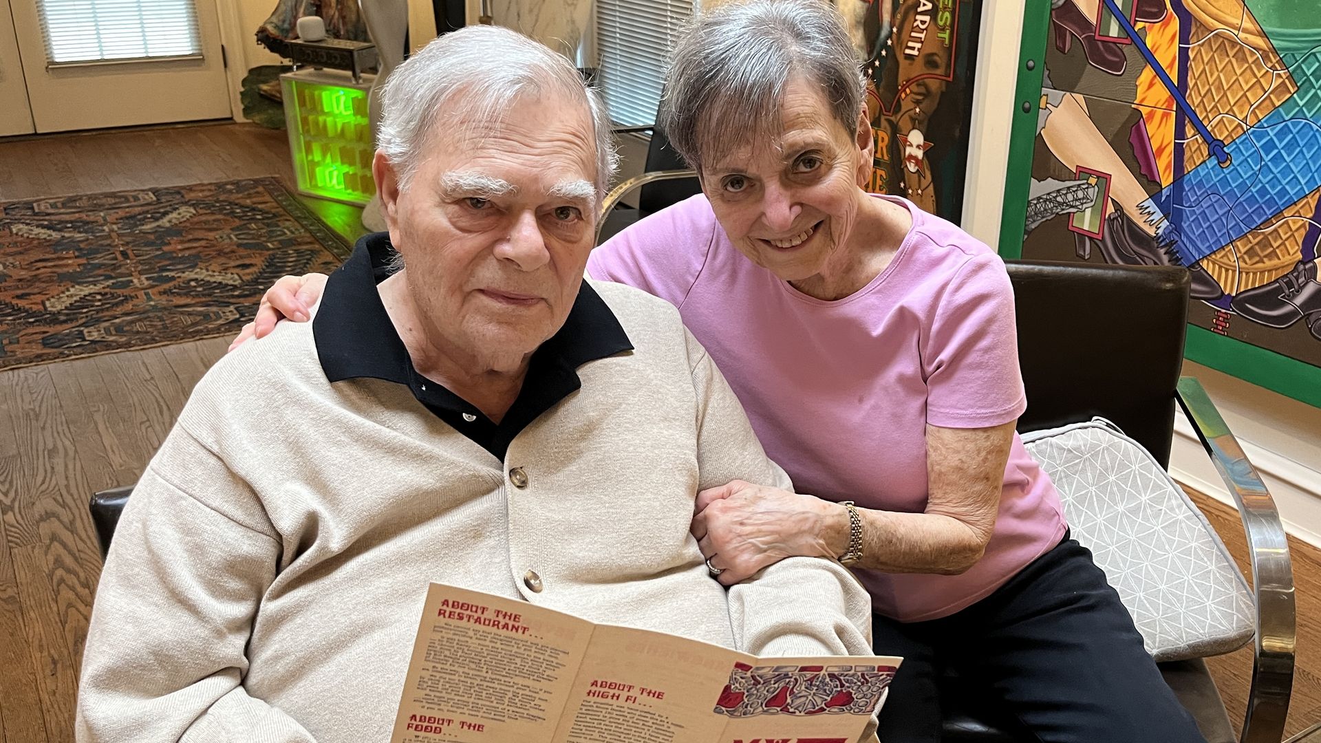 two people with a menu 