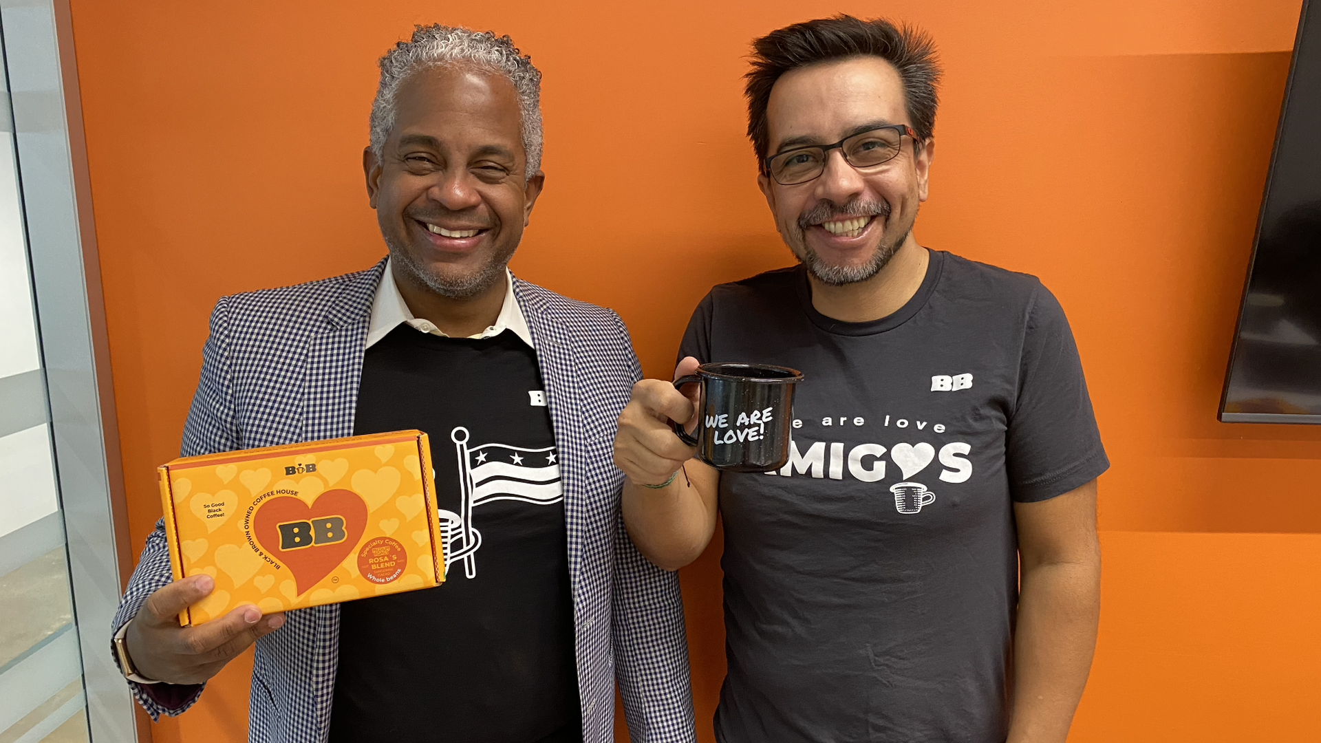 From left: Javier Llano and Karel Leon pose with Black and Brown Coffee House merchandise.