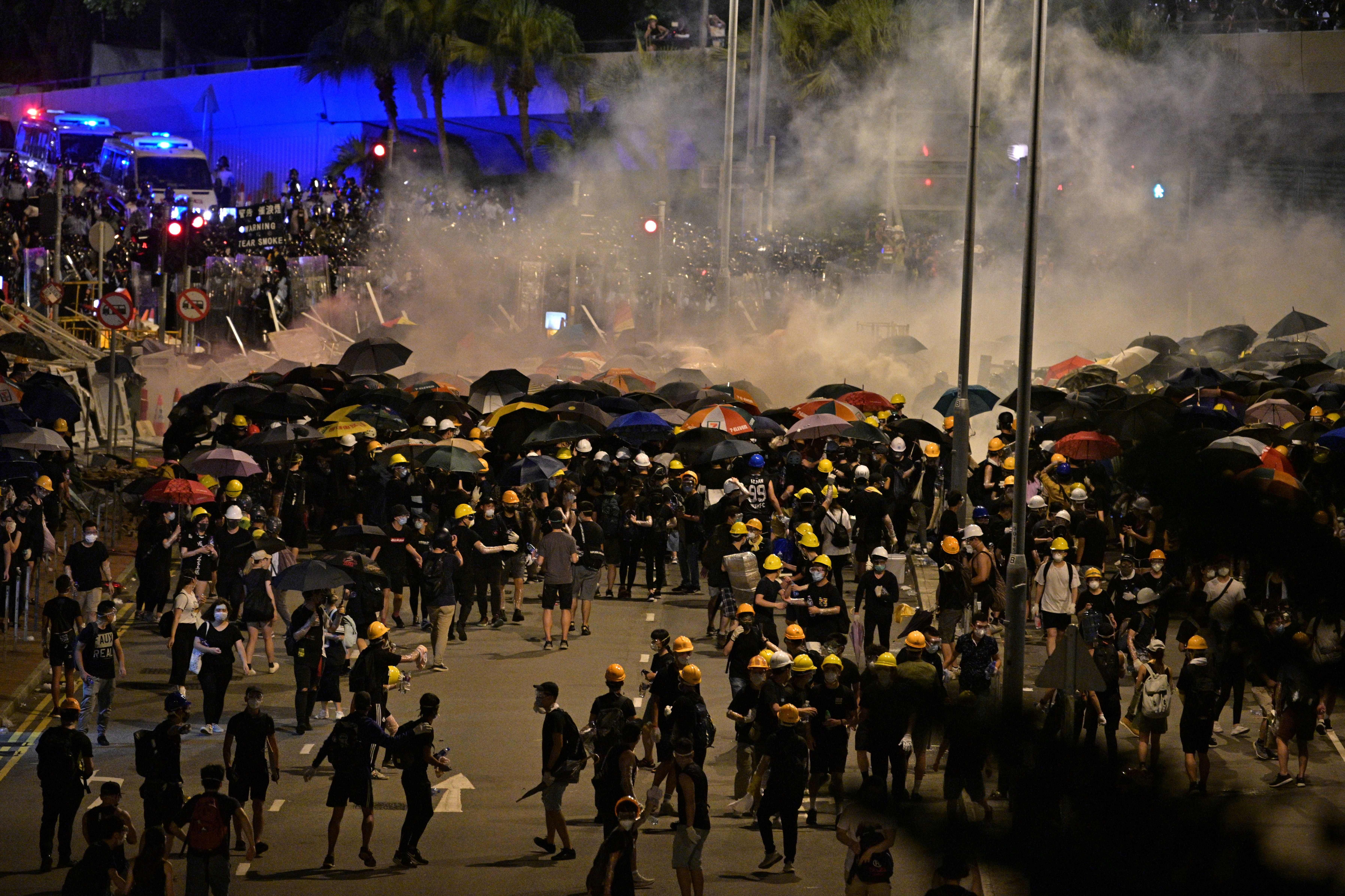  Police fire tear gas at protesters near the government headquarters in Hong Kong on July 2.