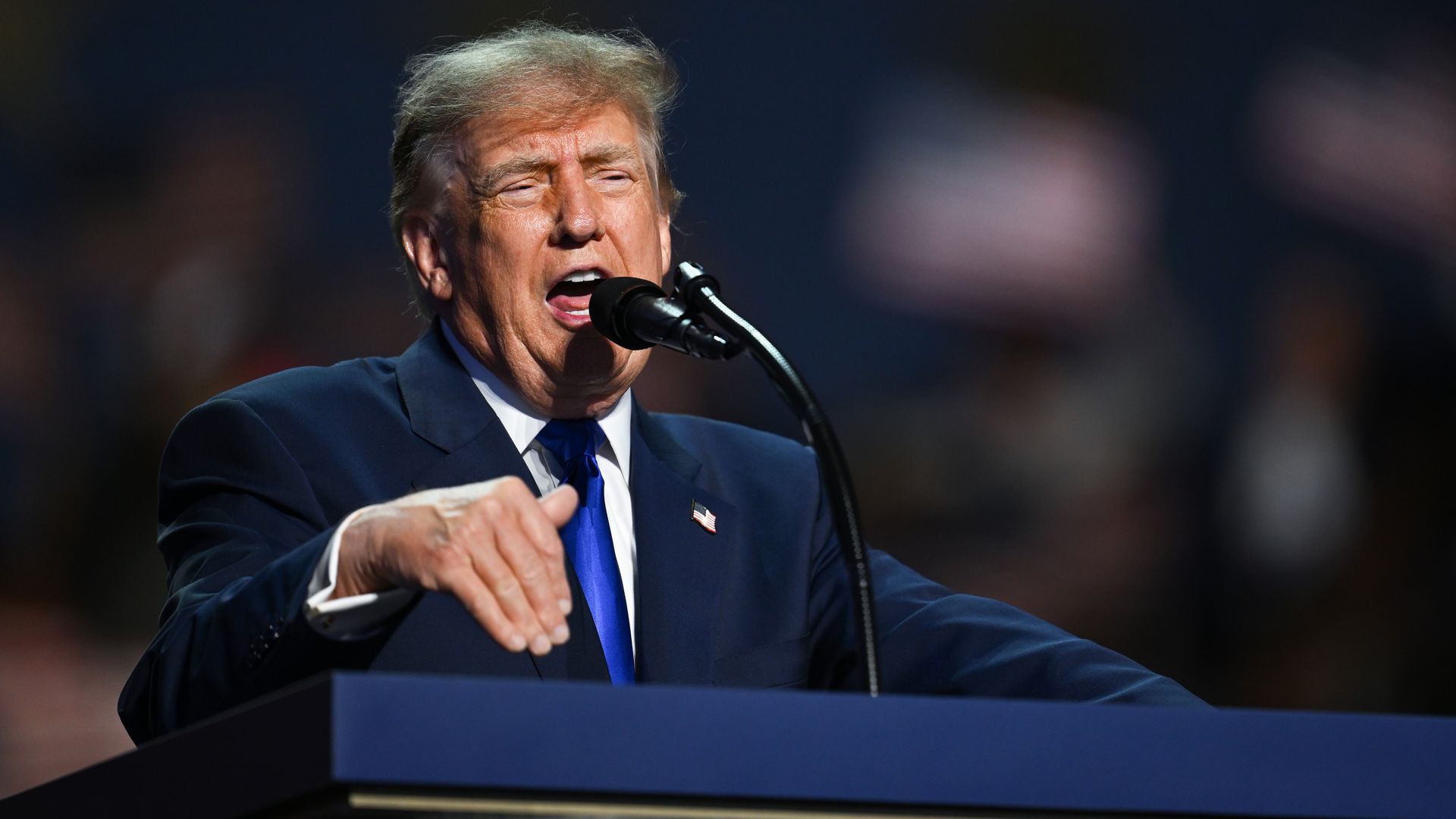 President Trump speaks onstage at the Republican midterm convention at American Airlines Center in Dallas.