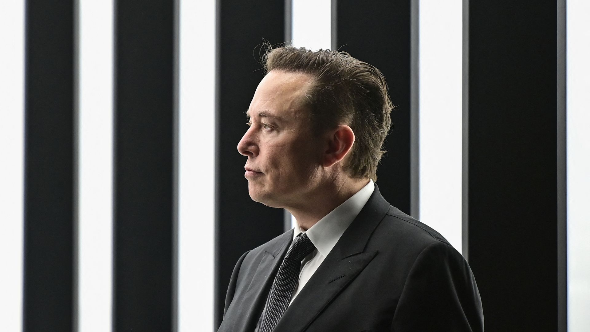 Tesla CEO Elon Musk is pictured as he attends the start of the production at Tesla's "Gigafactory" on March 22, 2022 in Gruenheide, southeast of Berli