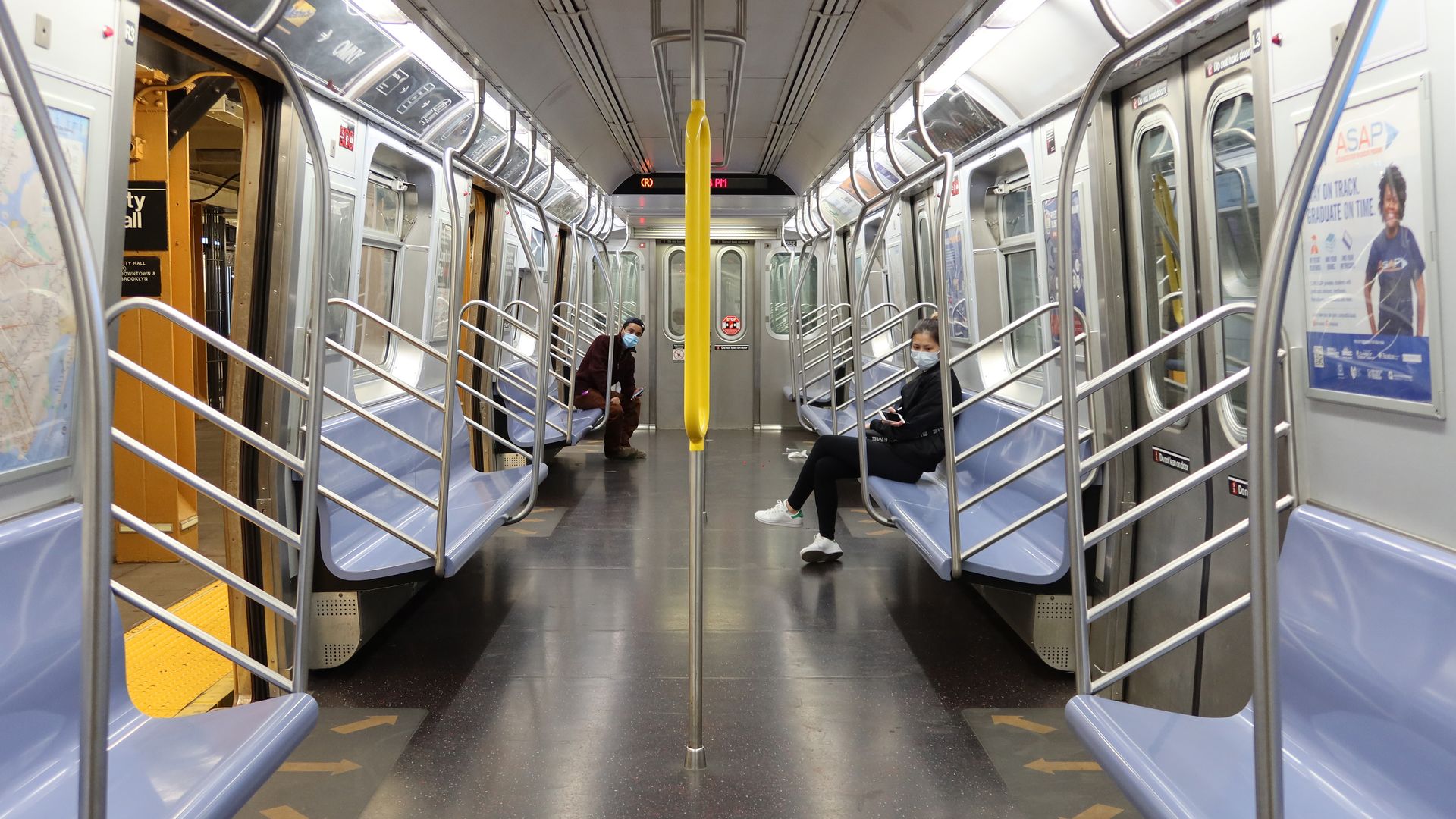 Image of a nearly empty subway car in New York