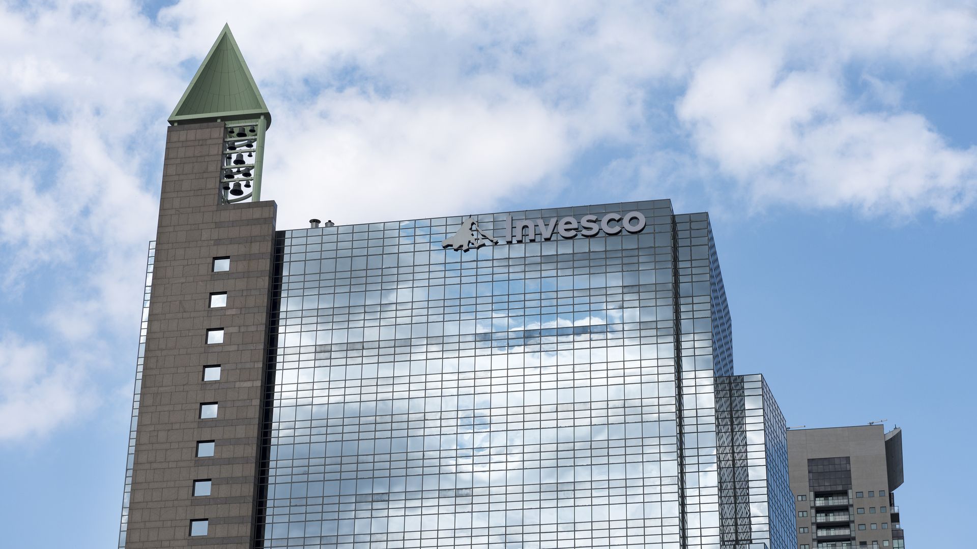 Invesco glass windowed building. Invesco is an American investment management company. 