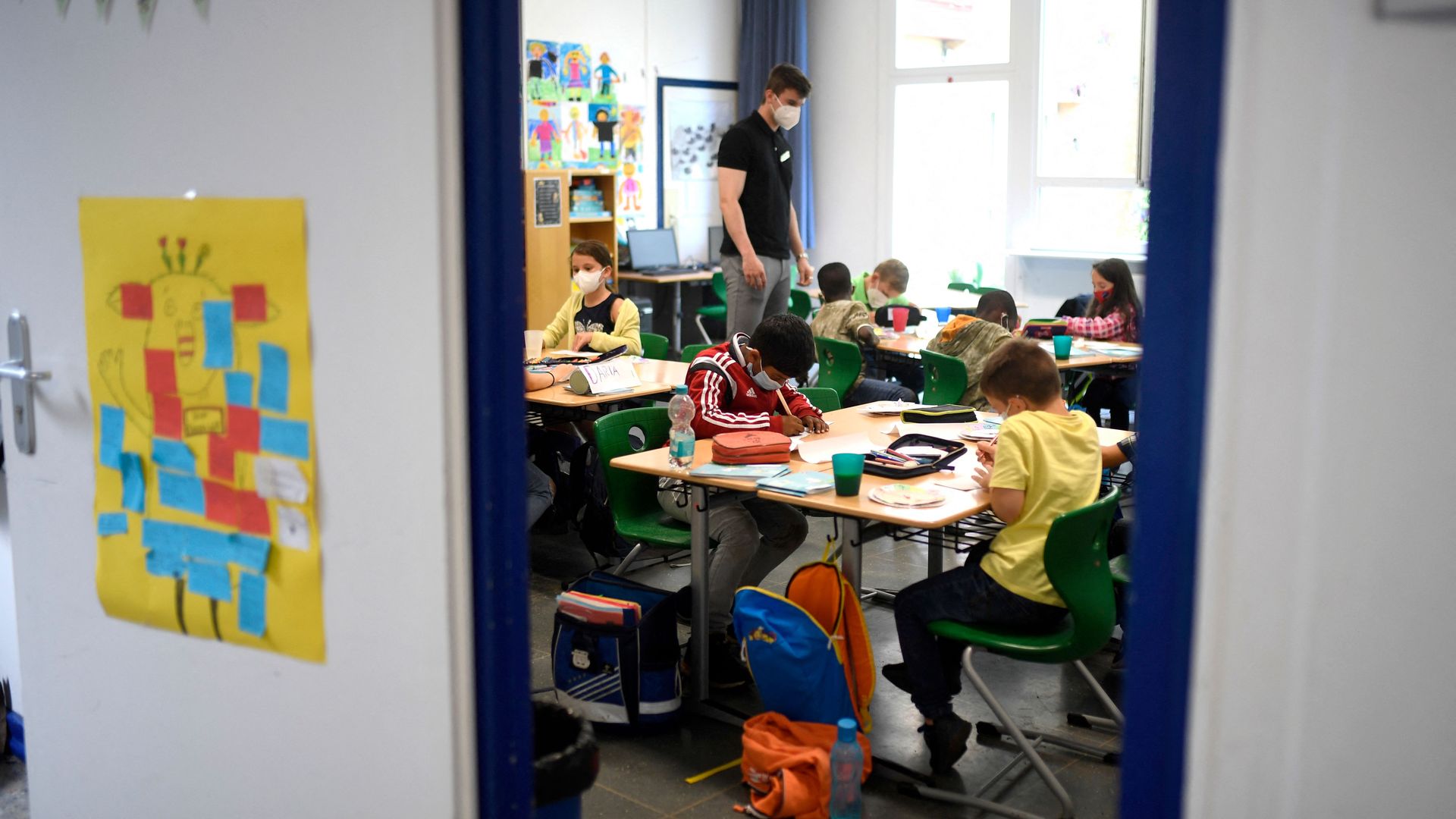 Teacher and students at school.