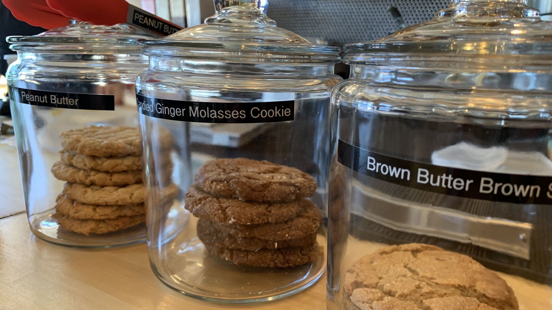 Three jars of different flavors of cookies.