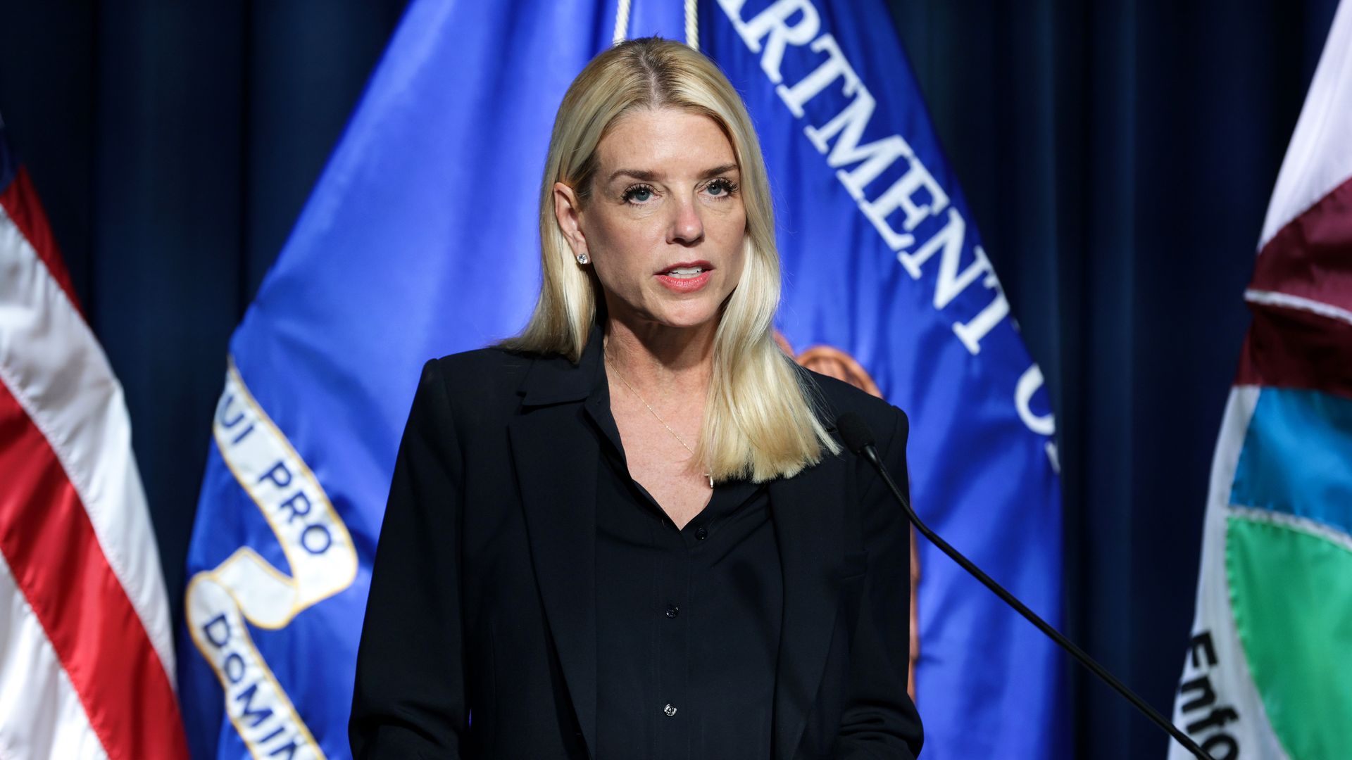  Attorney General Pam Bondi speaks during a news conference at the DEA headquarters on July 15, 2025 in Arlington, Virginia. ]