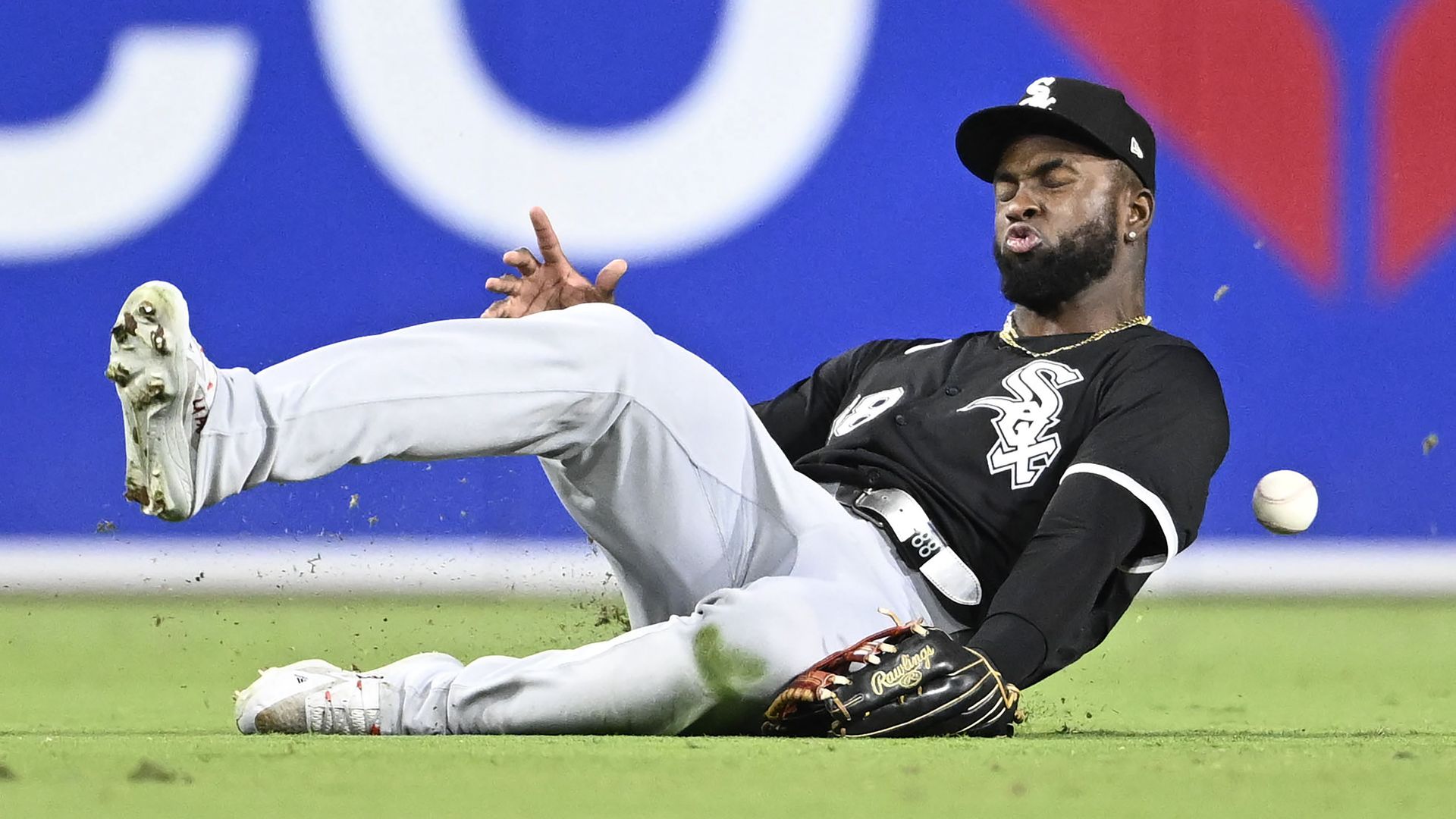 Photo of a baseball player diving for a ball