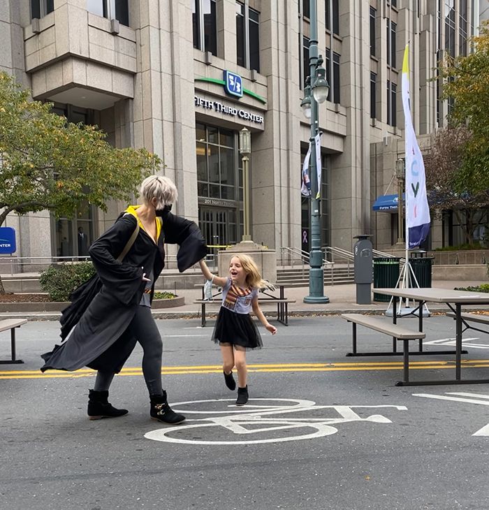 Allie Kelly and daughter dancing in Uptown after learning about Biden's victory