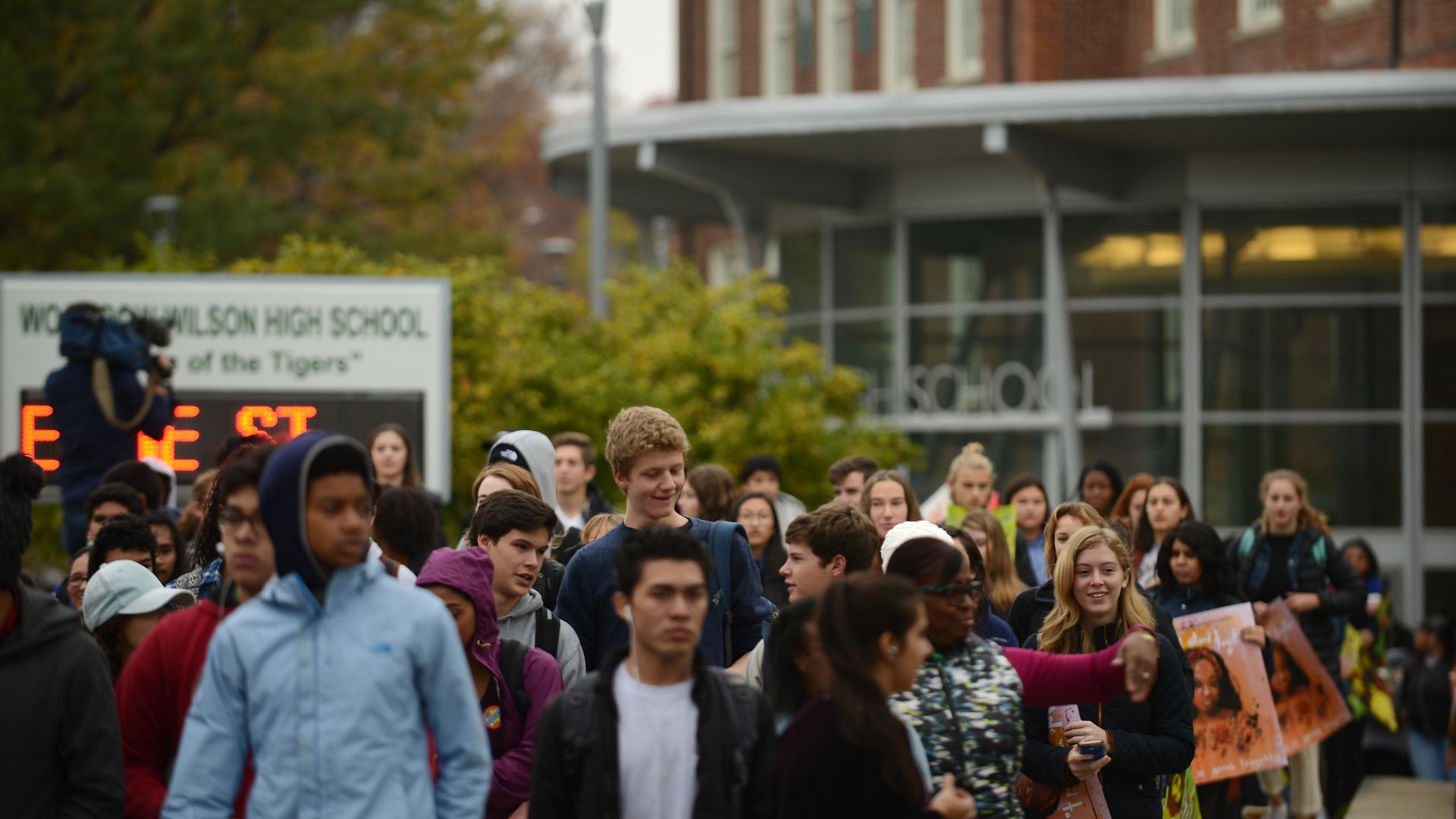 A photograph of students exiting Wilson High School in the background