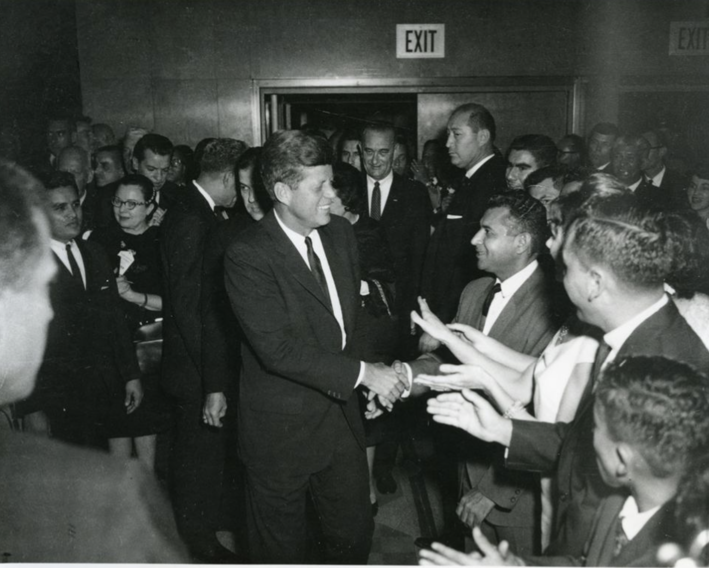 President John F. Kennedy greeting people at a Houston LULAC banquet in the Rice Hotel.