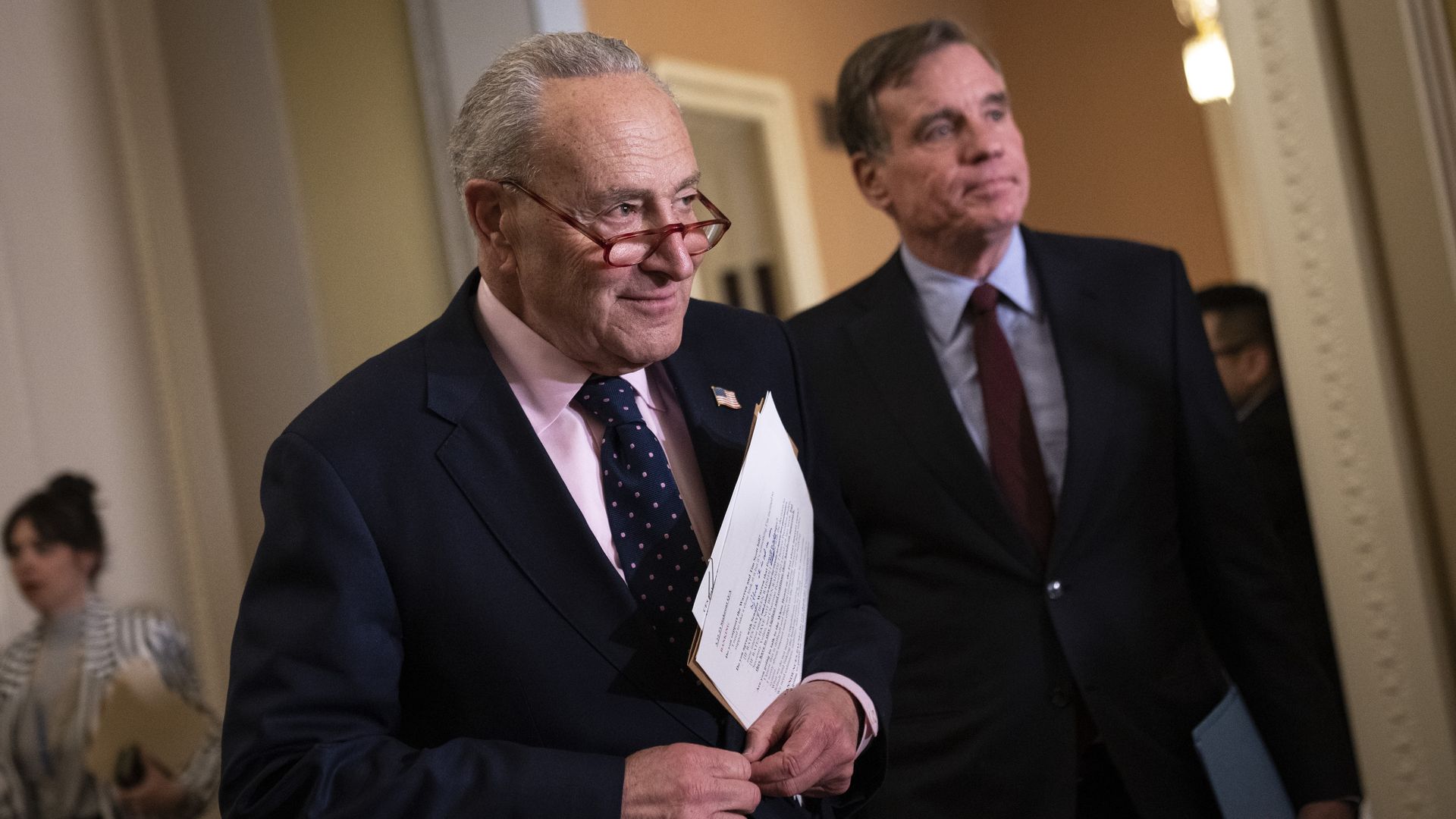Senate Majority Leader Chuck Schumer (D-NY) and Sen. Mark Warner (D-VA) arrives for a news conference following a closed-door lunch meeting with Senate Democrats at the U.S. Capitol March 22, 2023 in Washington, DC.