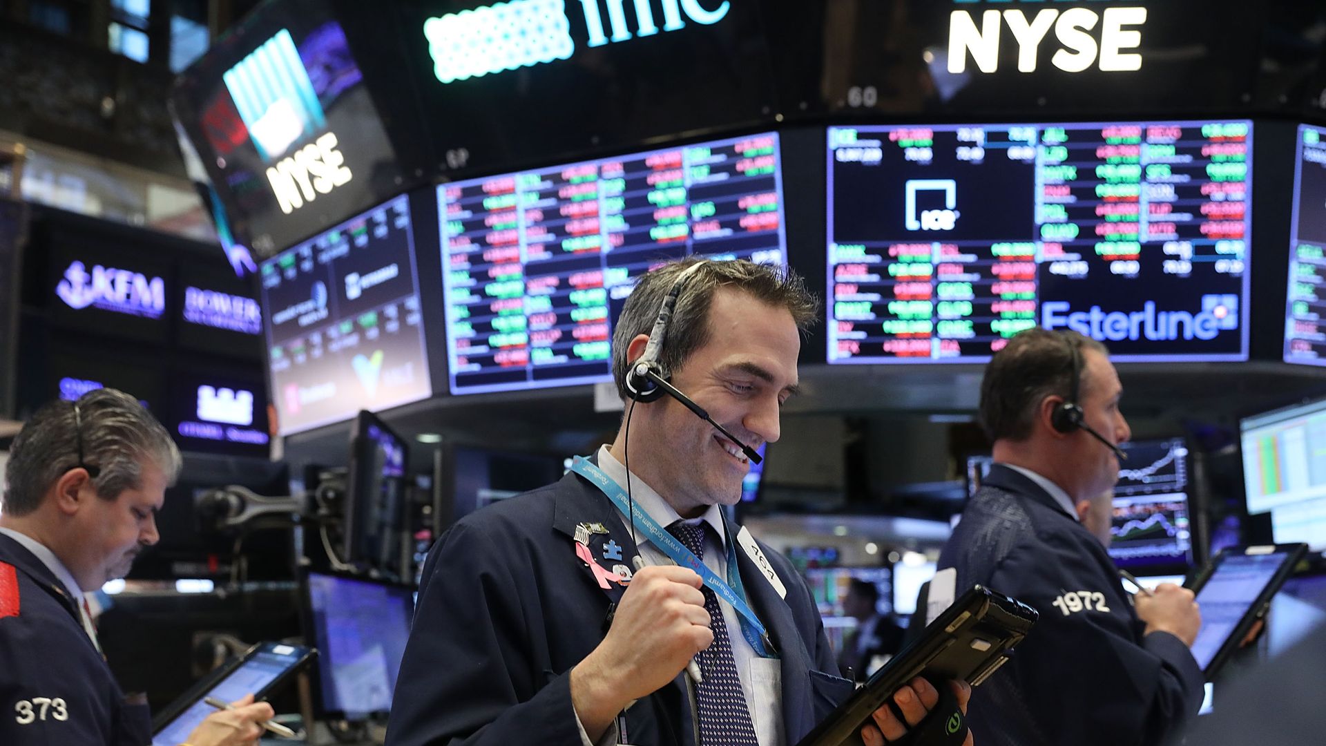 An excited trader on the floor of the stock exchange.