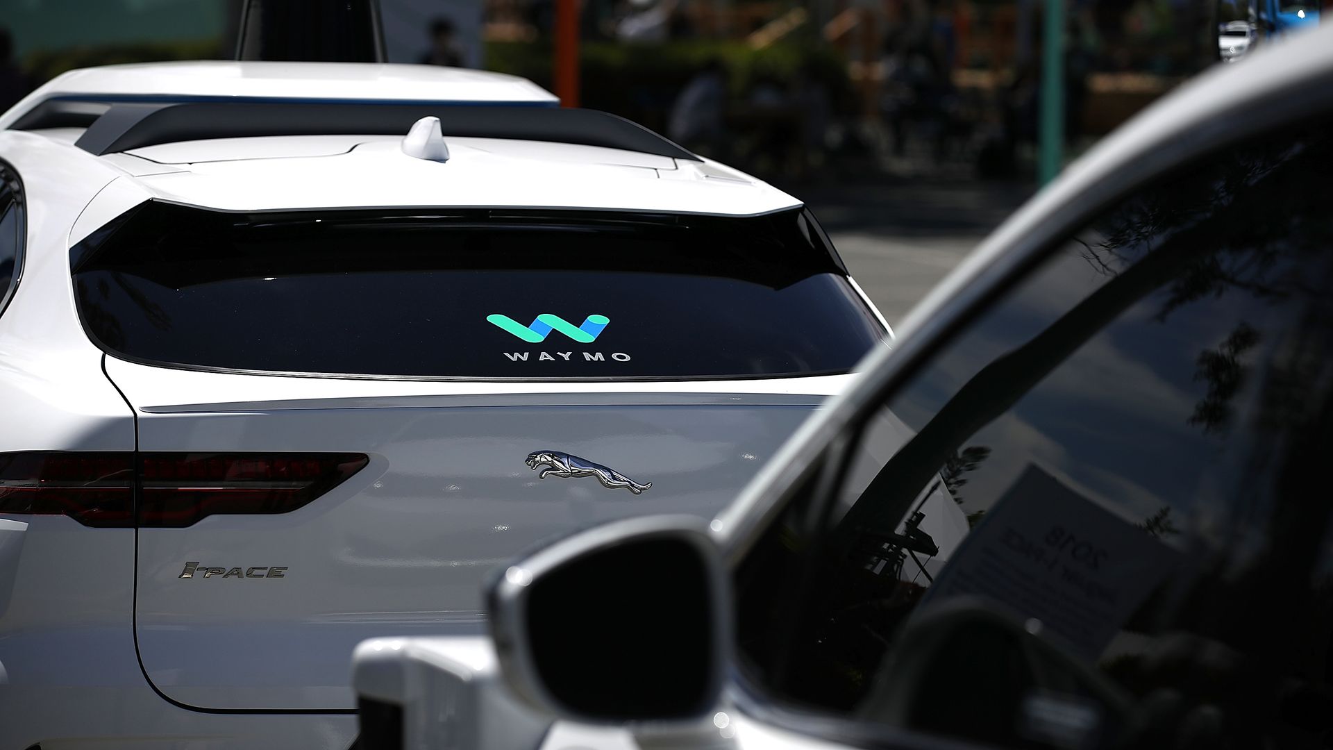 Waymo SUVs on the road