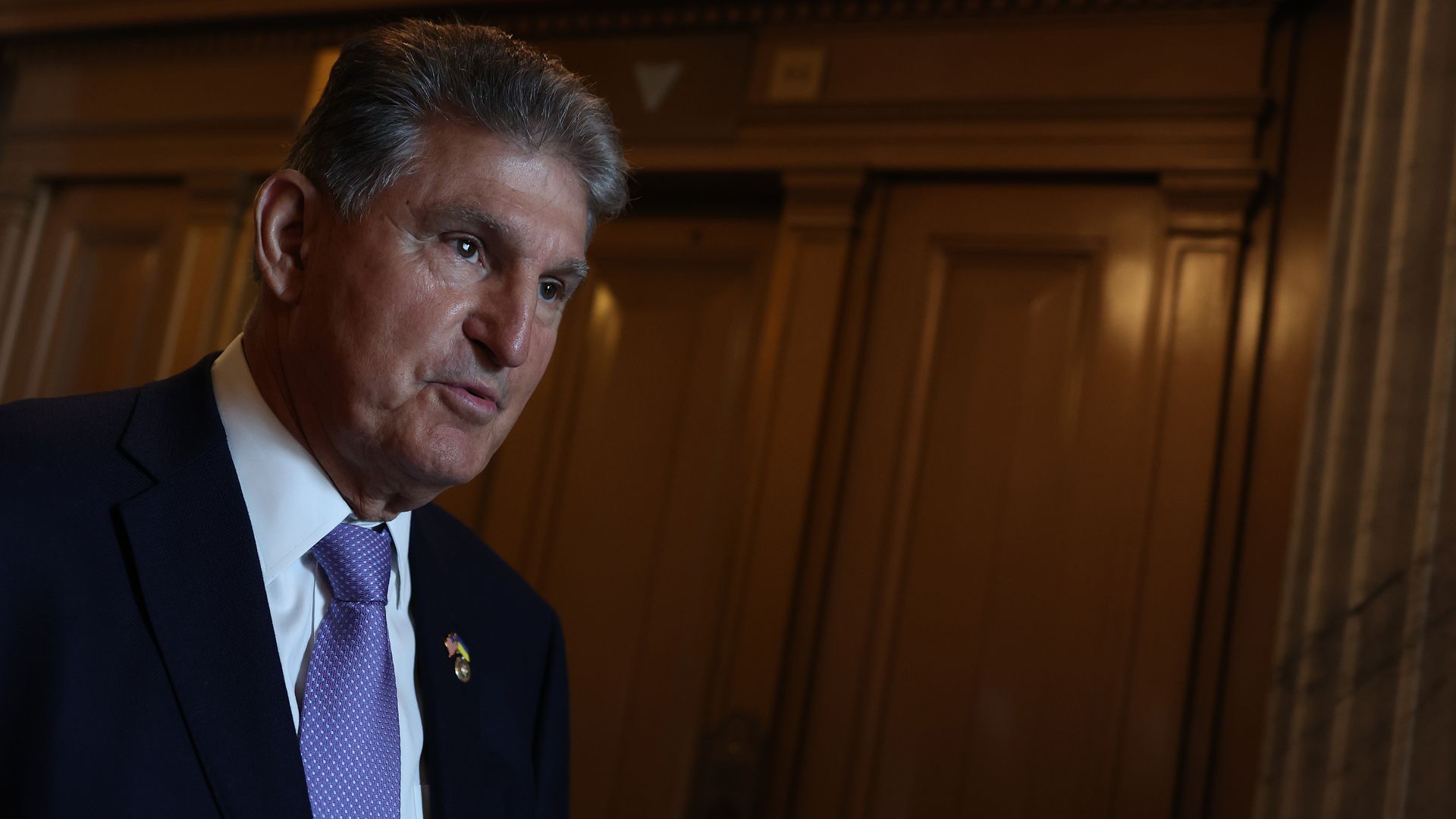 Sen. Joe Manchin (D-WV) walks out of the Senate Chambers in the U.S. Capitol on July 21, 2022 in Washington, DC.