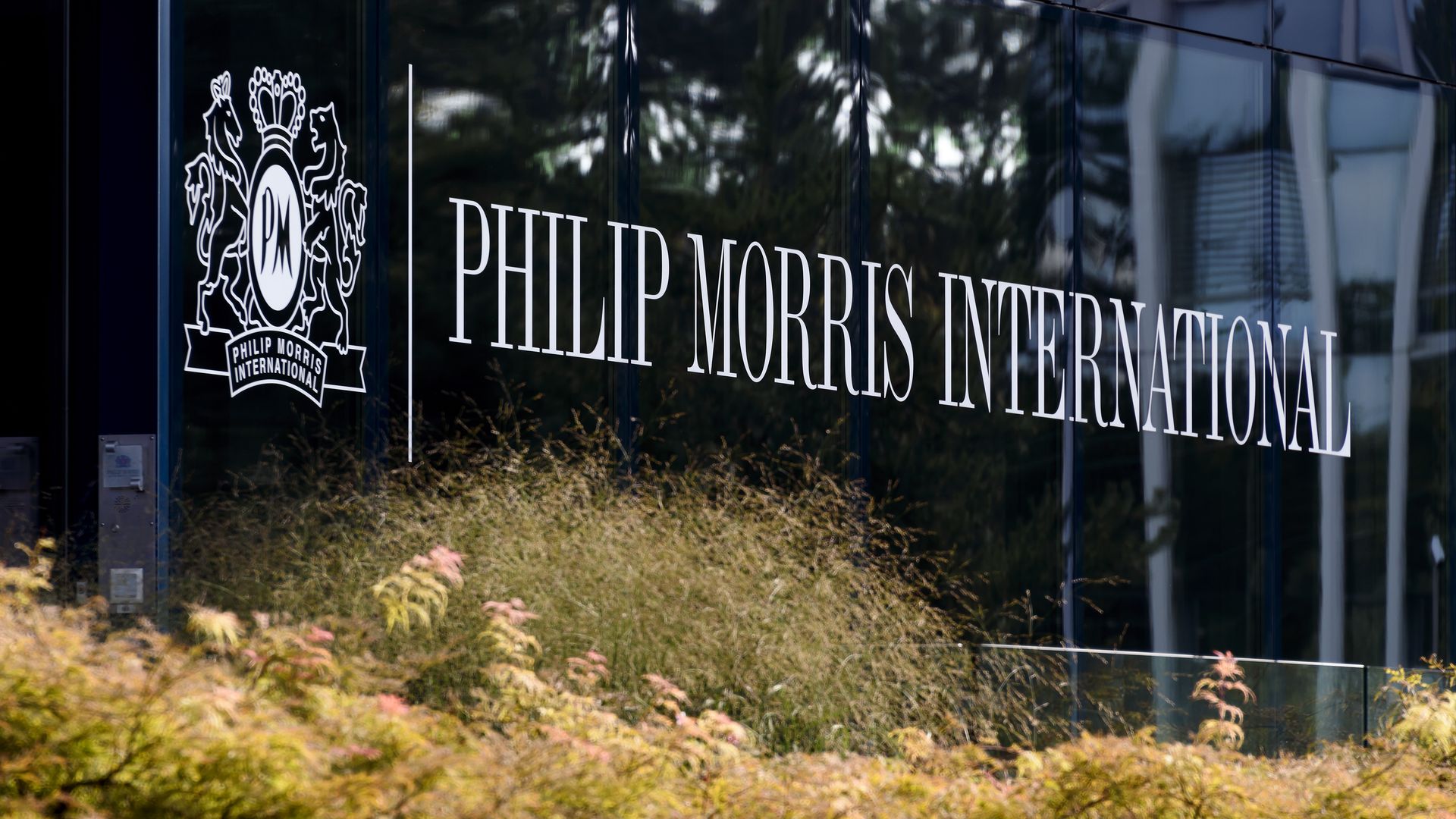 The words "Phillip Morris International" written on the side of its headquarters