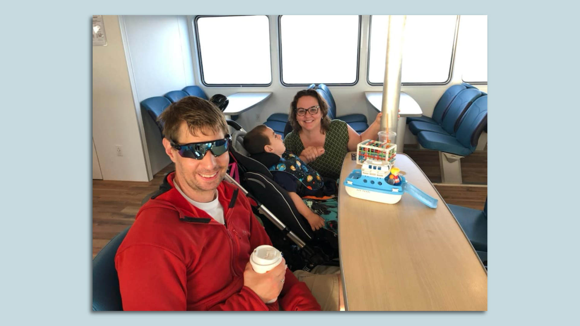 A family of three — Pete Tulipani, 4-year-old Petey and Lisa — are aboard the Lynn ferry.