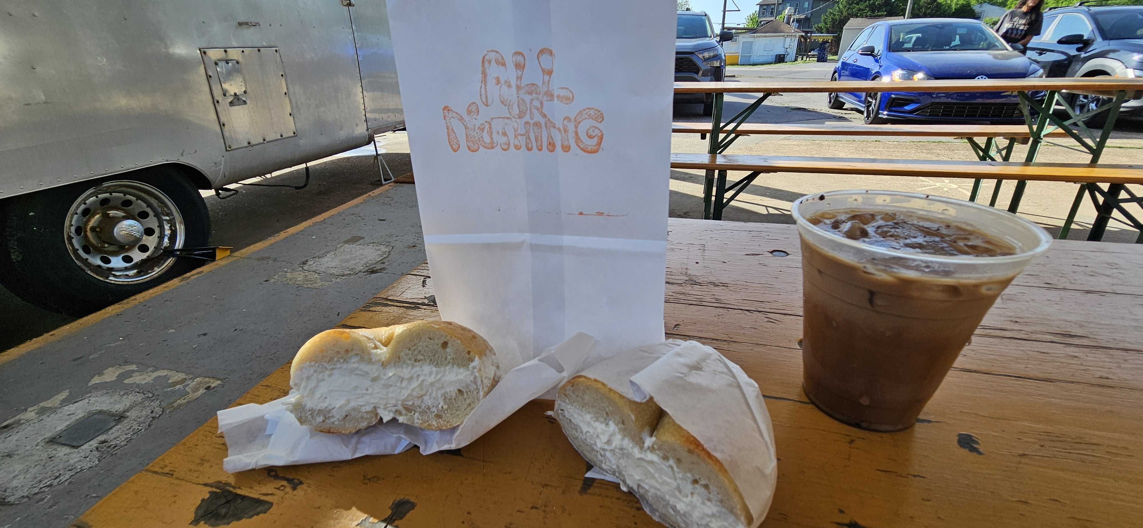A bagel from All or Nothing Bagels and coffee from Weak Coffee Co.