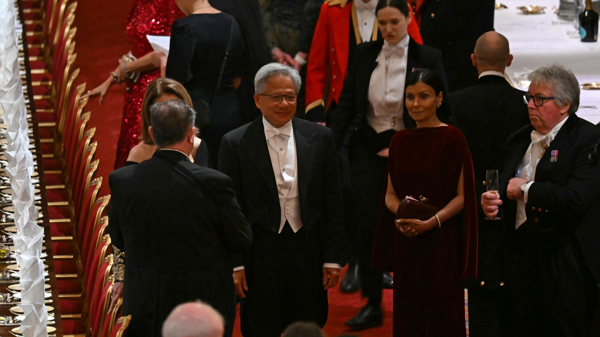 Nvidia CEO Jensen Huang standing at a U.K. state dinner for President Trump