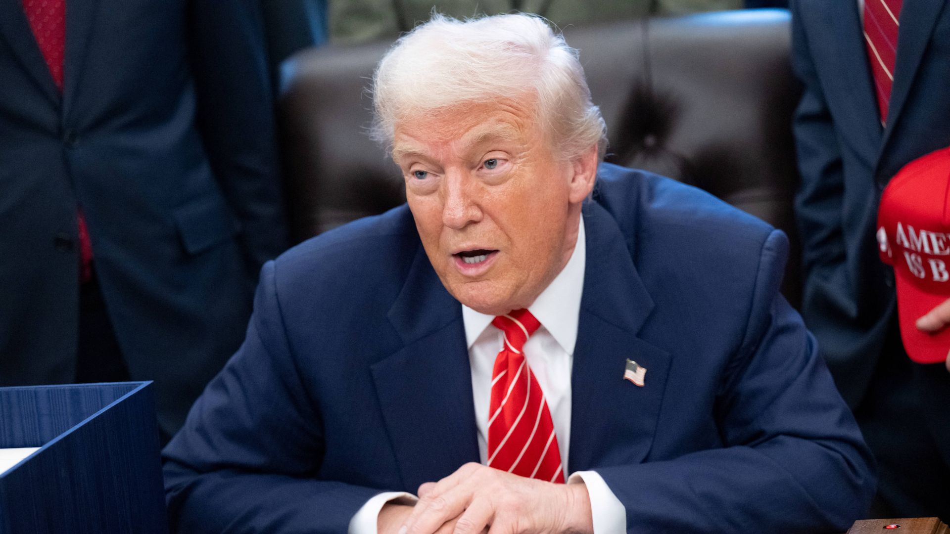 Donald Trump speaks with the media after signing a funding bill to end a partial government shutdown in the Oval Office of the White House in Washington, DC, February 3, 2026.