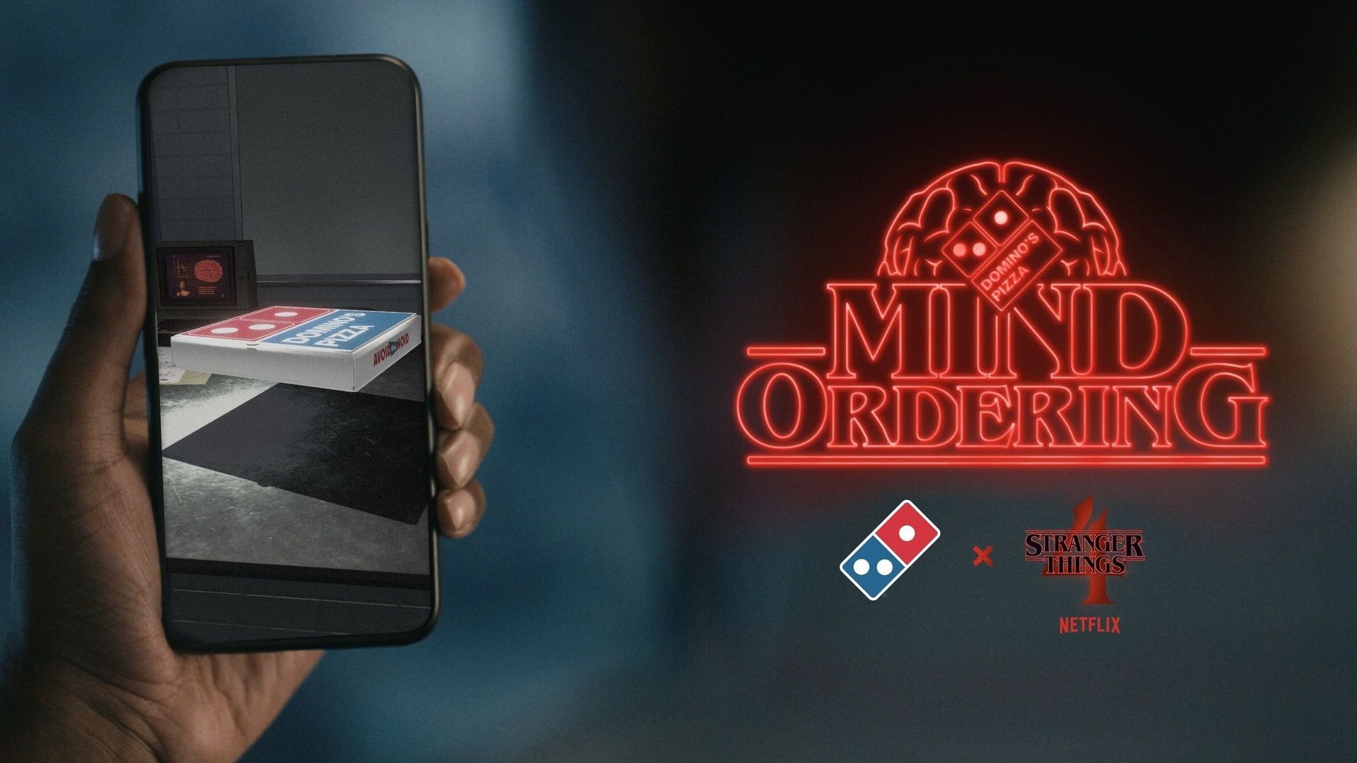 A dominos pizza in a smart phone screen.