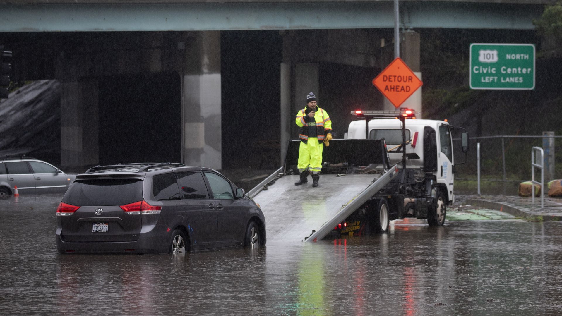 tow truck driver retrieving car