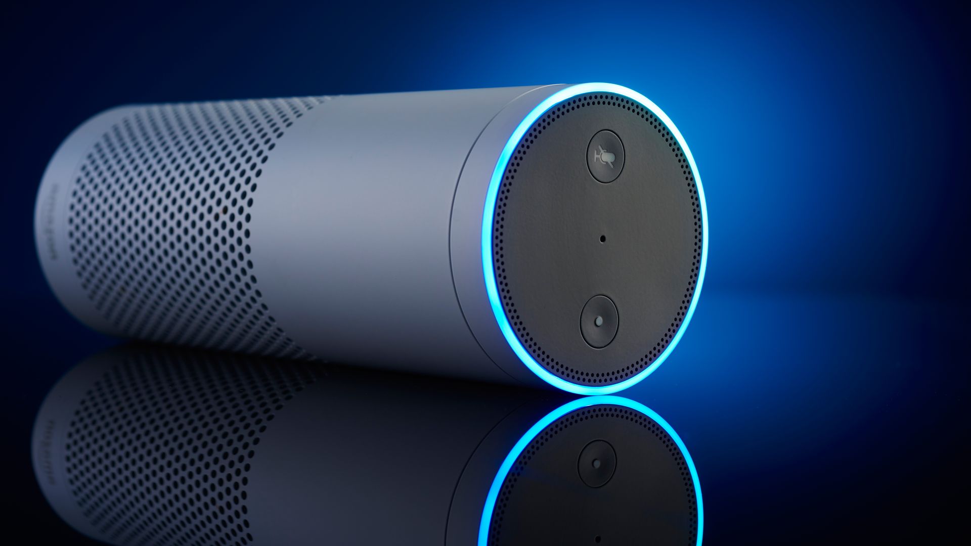 An Echo speaker against a blue backdrop