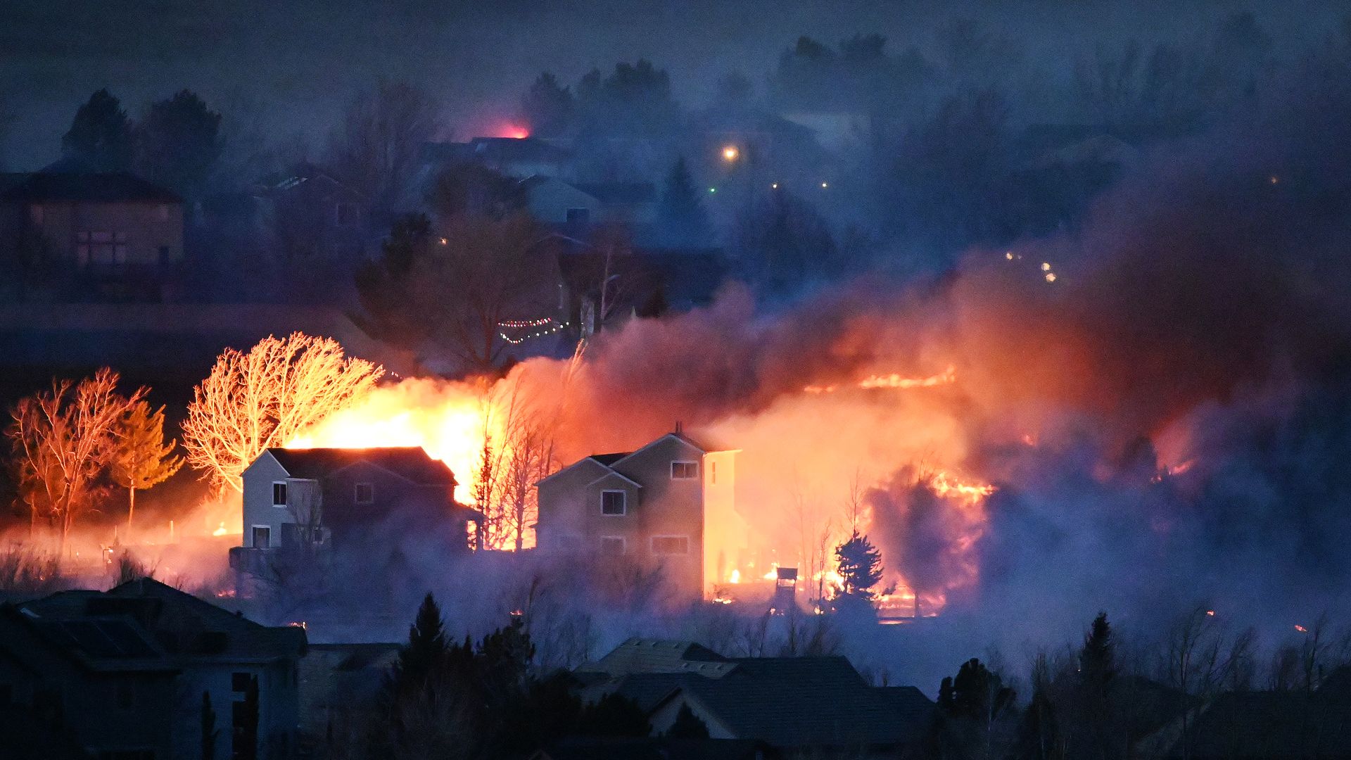 Picture of flames burning homes during the Marshall Fire in Colorado.