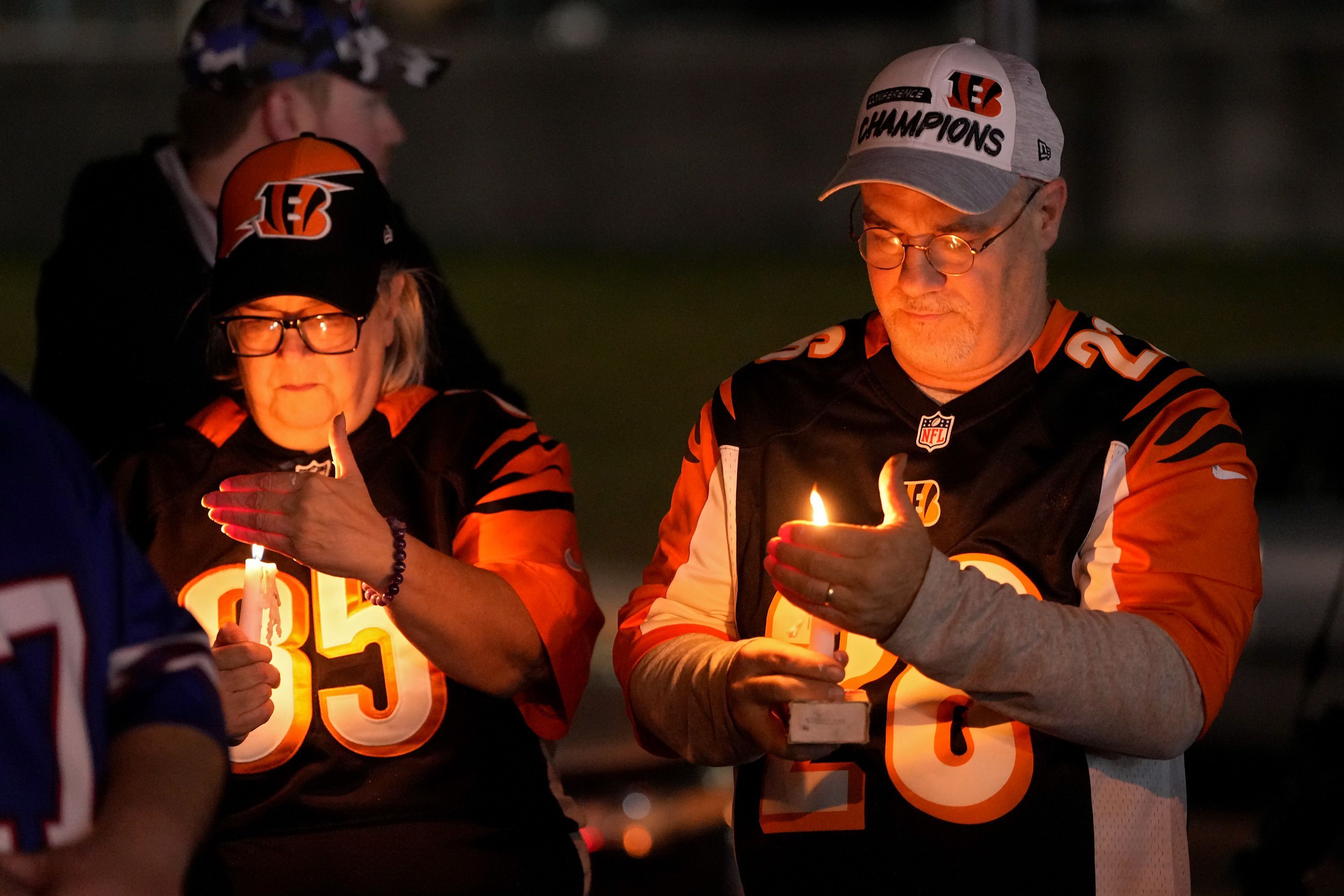 Fans gather at a vigil at the University of Cincinnati Medical Center late Monday night.