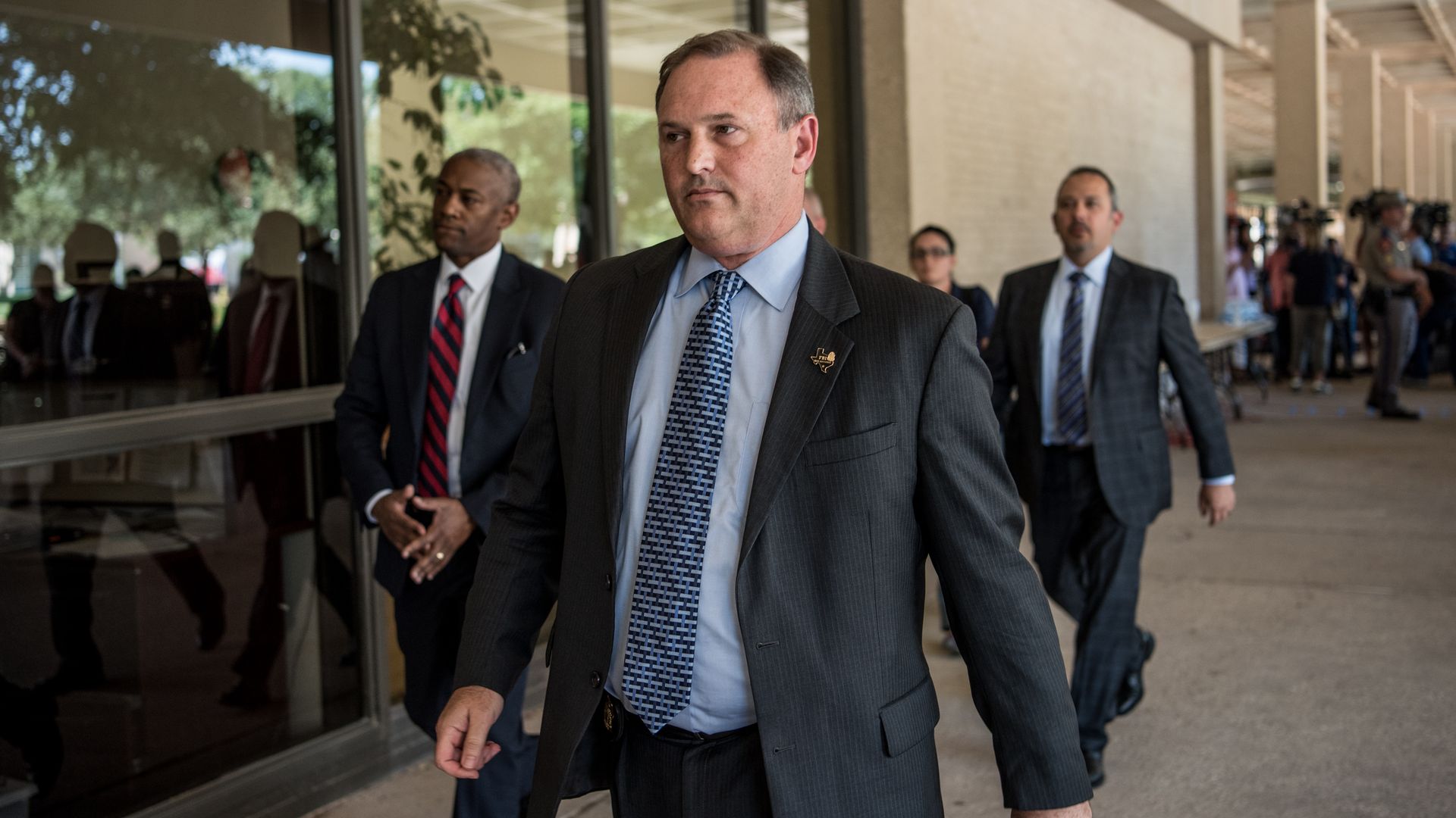 FBI Special Agent Christopher Combs leaves a press conference