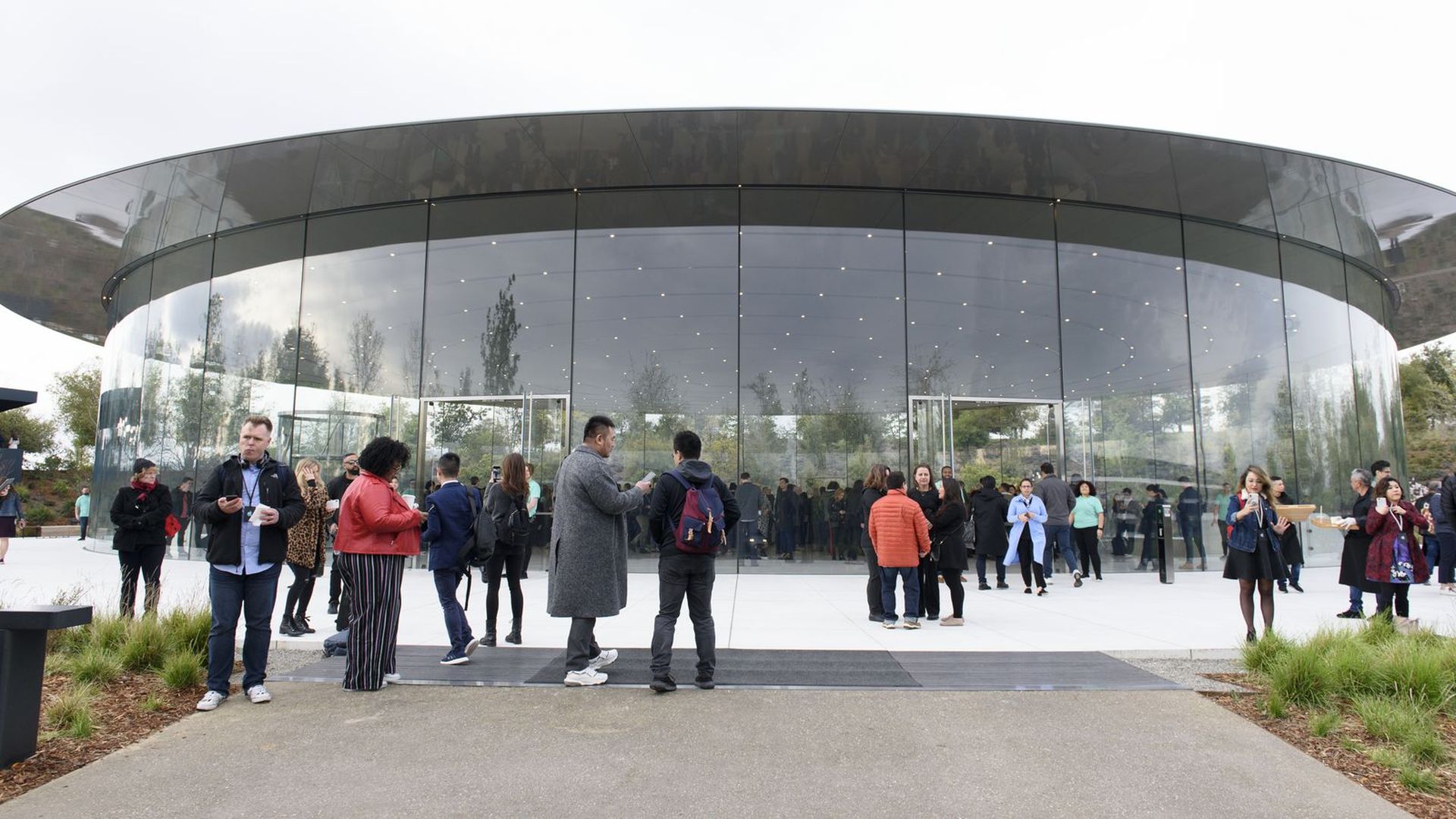 A crowd outside Steve Jobs Theater at Apple's headquarters.