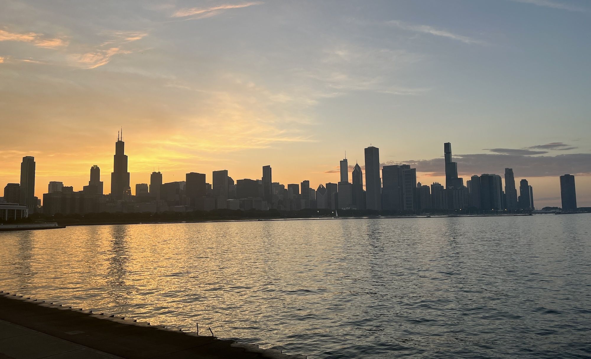Photo of sunset with buildings in background