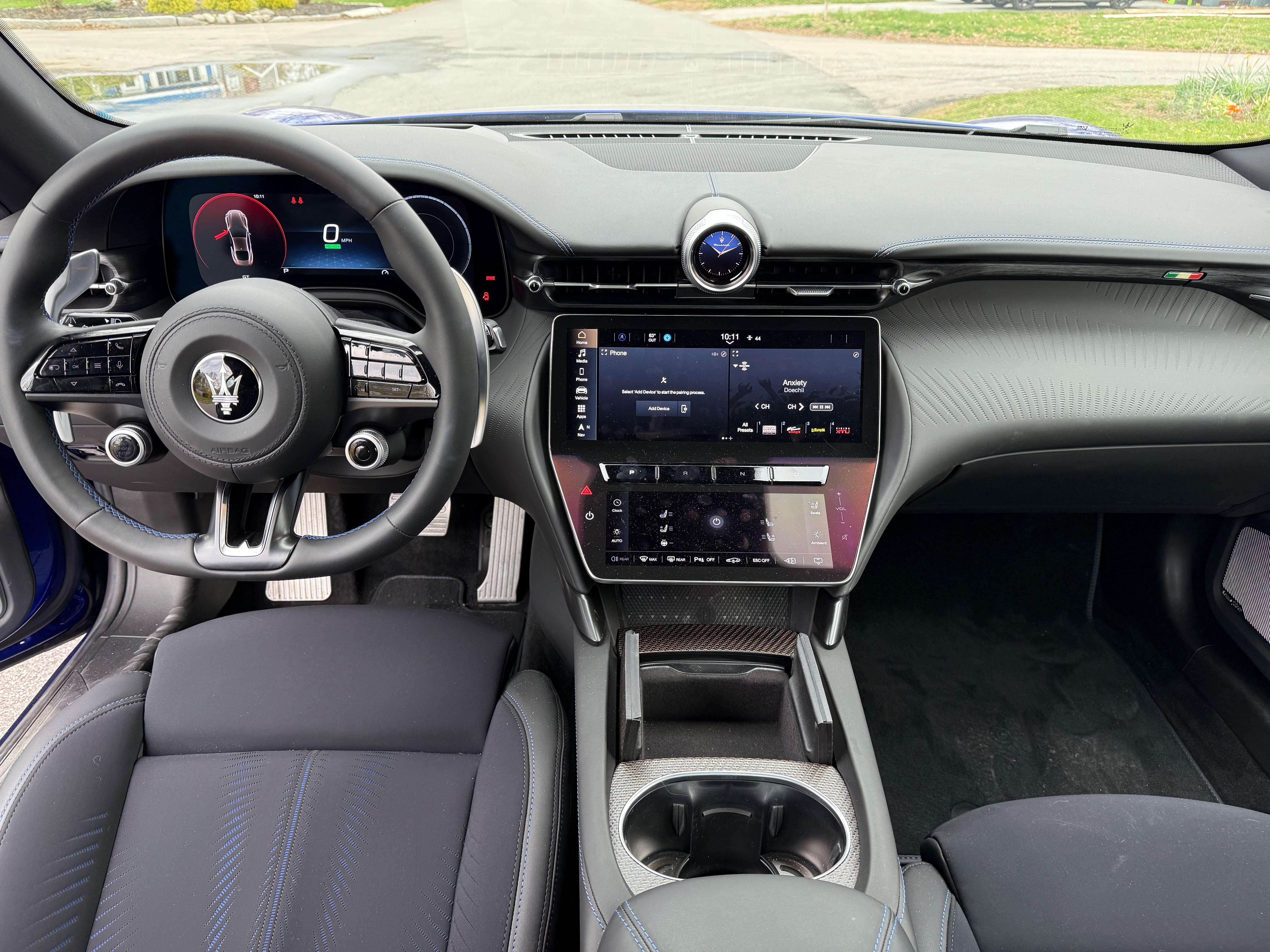 The interior of the Maserati Folgore GranTurismo is relatively spartan for a vehicle this expensive — a center touch screen, but not much else.