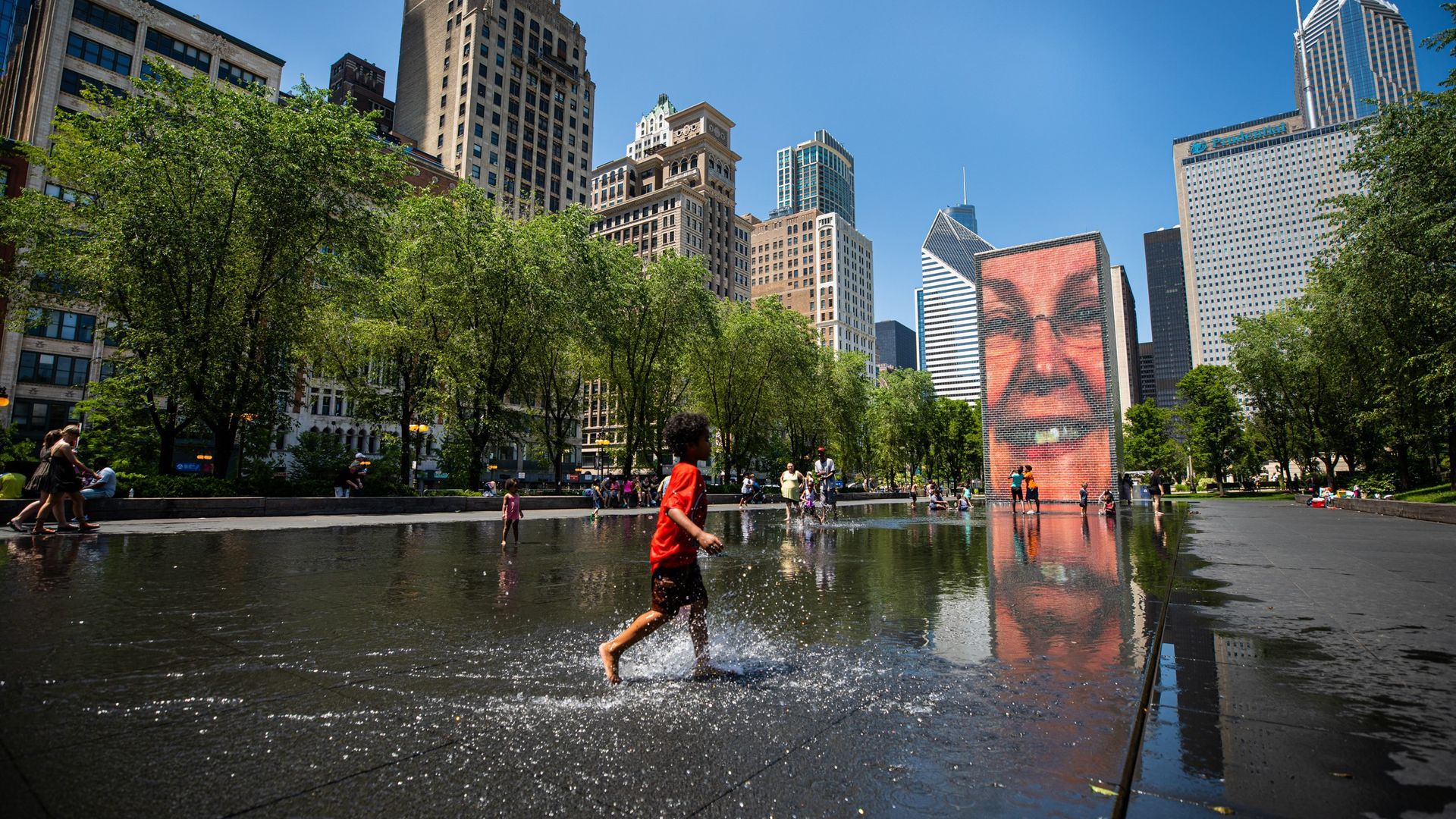 A boy walking in Chicago.